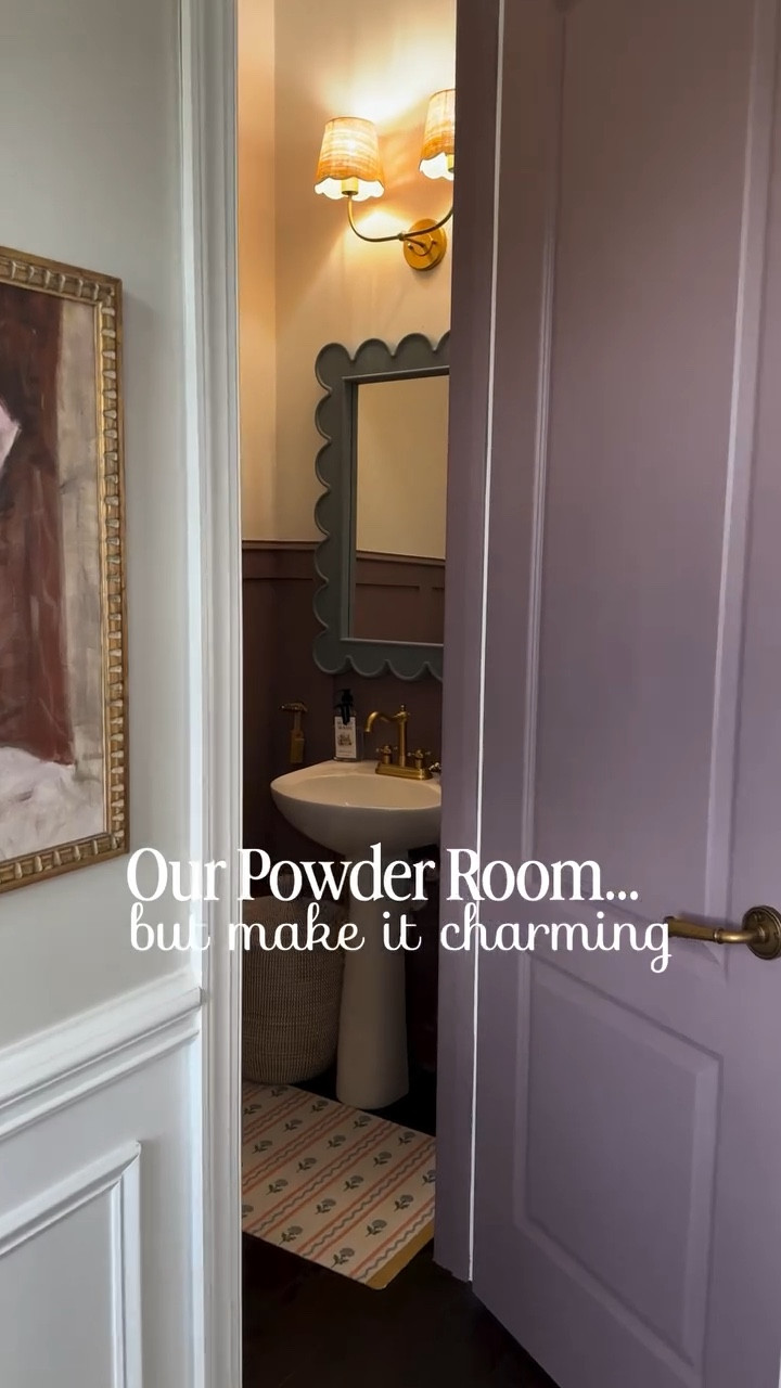 There’s something about a powder room that feels like permission to take a design risk… and I went all in 🤎

Moody mauve paneling, warm brass, a vintage-inspired scalloped mirror, and the sweetest little details layered in to make this tiny space feel intentional and cozy.

This room might be small, but it’s one of my favorites in the house now.

Everything is linked in my LTK (mirror, faucet, hardware, rug, lighting + more) for anyone wanting to recreate this look 🫶🏼

Would you go bold in a small space or keep it neutral?

⸻

powder room reveal, small bathroom design, moody bathroom ideas, mauve bathroom walls, purple bathroom decor, feminine bathroom design, vintage inspired bathroom, scalloped mirror bathroom, brass bathroom fixtures, pedestal sink styling, powder room makeover, small space home decor, cozy bathroom aesthetic, cottage style bathroom, modern vintage bathroom

⸻

#powderroom #powderroomdesign #bathroomreveal #bathroomdecor #smallbathroom #smallspacedesign #moodyhome #moodyinteriors #bathroominspo #interiordesignideas #homedecorinspo #myhomestyle #vintagestylehome #femininehome #ltkhome #liketkit #homeinspo #decorinspiration #cozyhome #housebeautiful


#LTKHome #LTKSeasonal #LTKSaleAlert