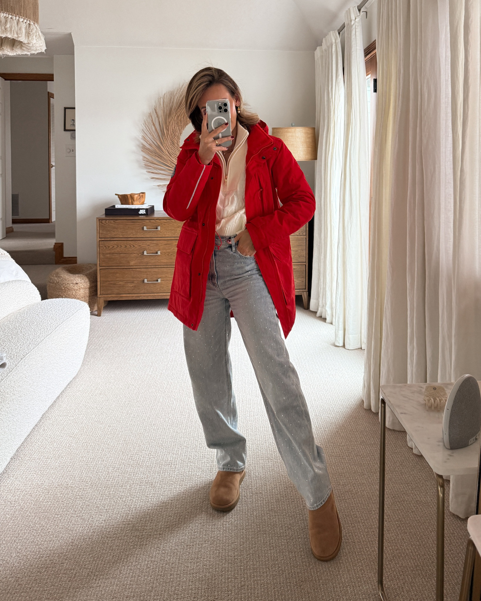The perfect pop of red to wear when it’s nothing but dreary 🙌🏽 Cherry red is having a moment in the spotlight right now, and this waterproof parka offers the ideal dose of it. It’s lightweight yet plenty warm for moody weather (and it would be easy to pack!) I styled it with my new fave sparkly jeans, which are currently on sale, and a cozy cable knit half zip. UGG boots add a practical and trendy finishing touch. 

#LTKStyleTip #LTKSaleAlert #LTKSeasonal