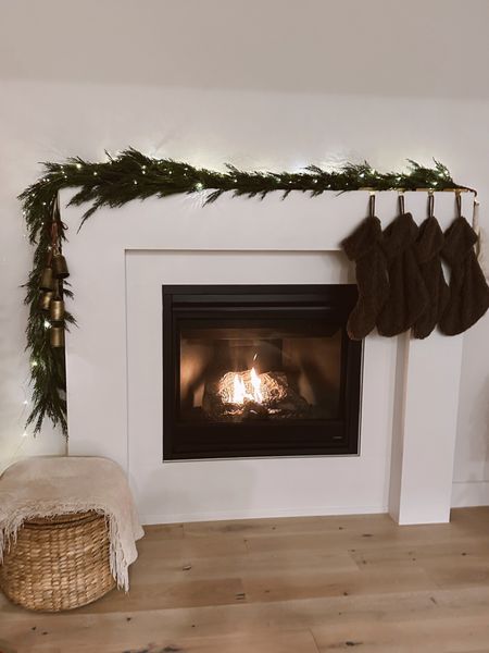 BEST NORFOLK GARLAND ON SALE FOR $29!!!! Looks so similar to this one. I bought 5! Will sell out. Brown boucle stockings. Woven storage ottoman  

#LTKhome #LTKHoliday #LTKGiftGuide