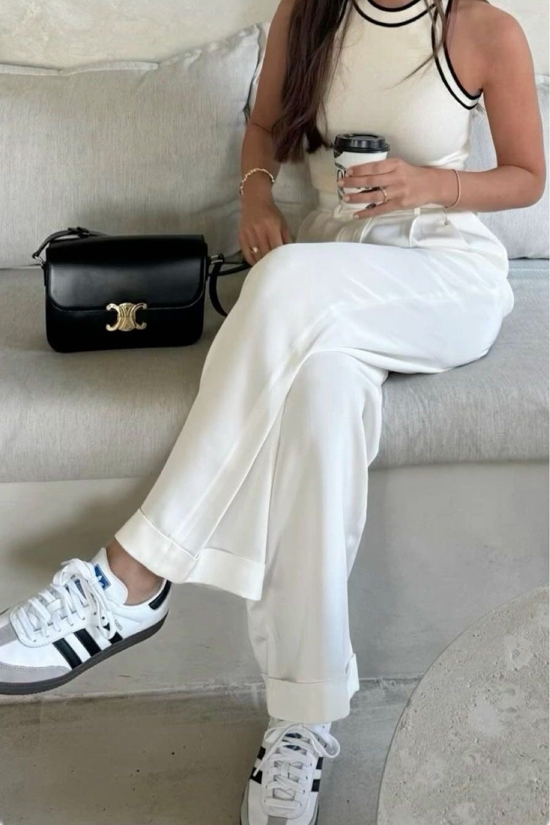 Effortlessly chic with a touch of sporty elegance! 🖤 The sleek black bag and classic Adidas sneakers perfectly complement the crisp white ensemble, striking the perfect balance between casual and sophisticated. #FashionInspo #ChicAndCasual #StyleGoals

#LTKStyleTip #LTKItBag #LTKShoeCrush