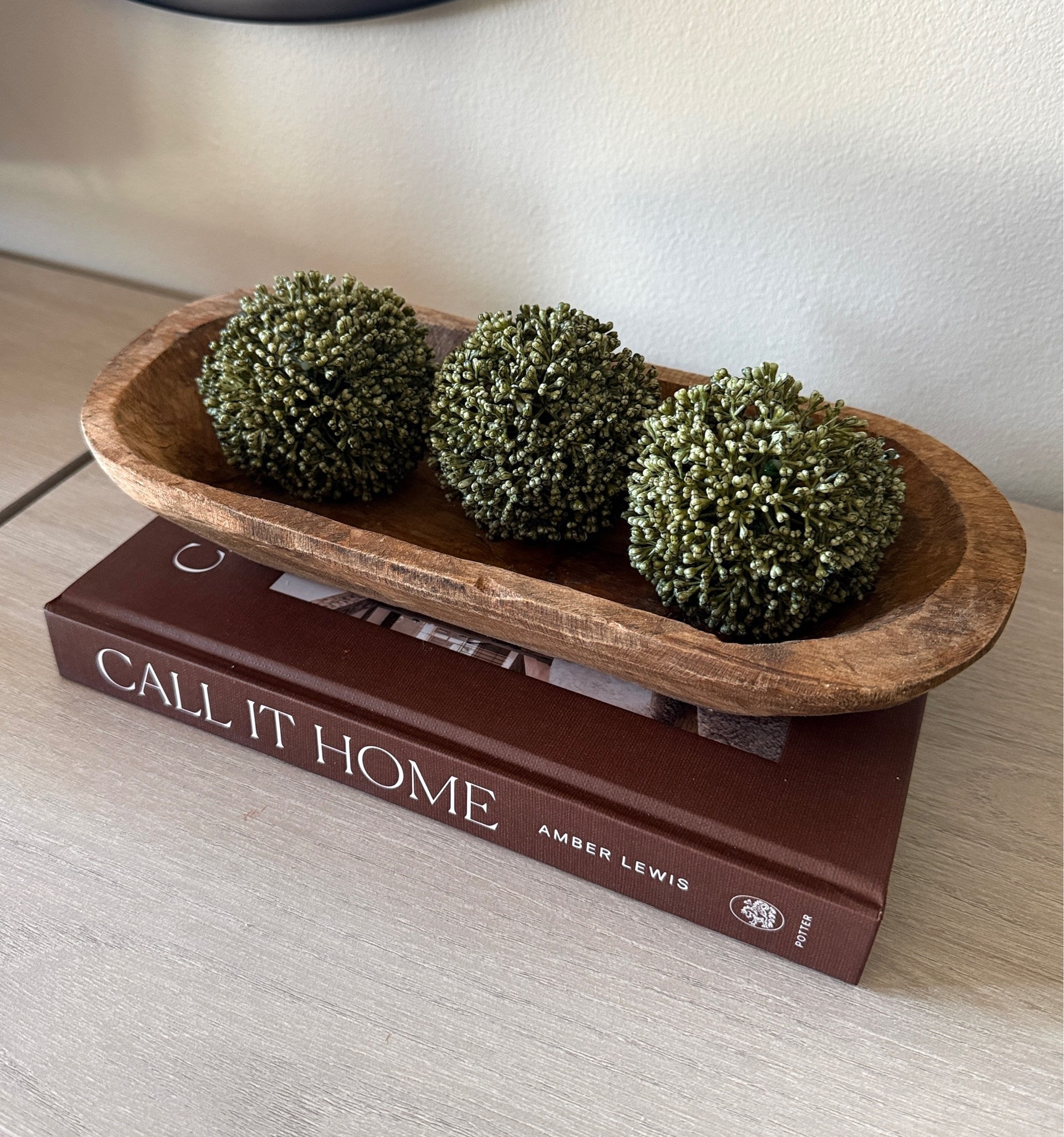 Easy neutral home decor styling 🤎 Coffee table books, natural wood tones + a little greenery will forever be my favorite combo. Such a simple way to make a space feel more finished without doing too much.