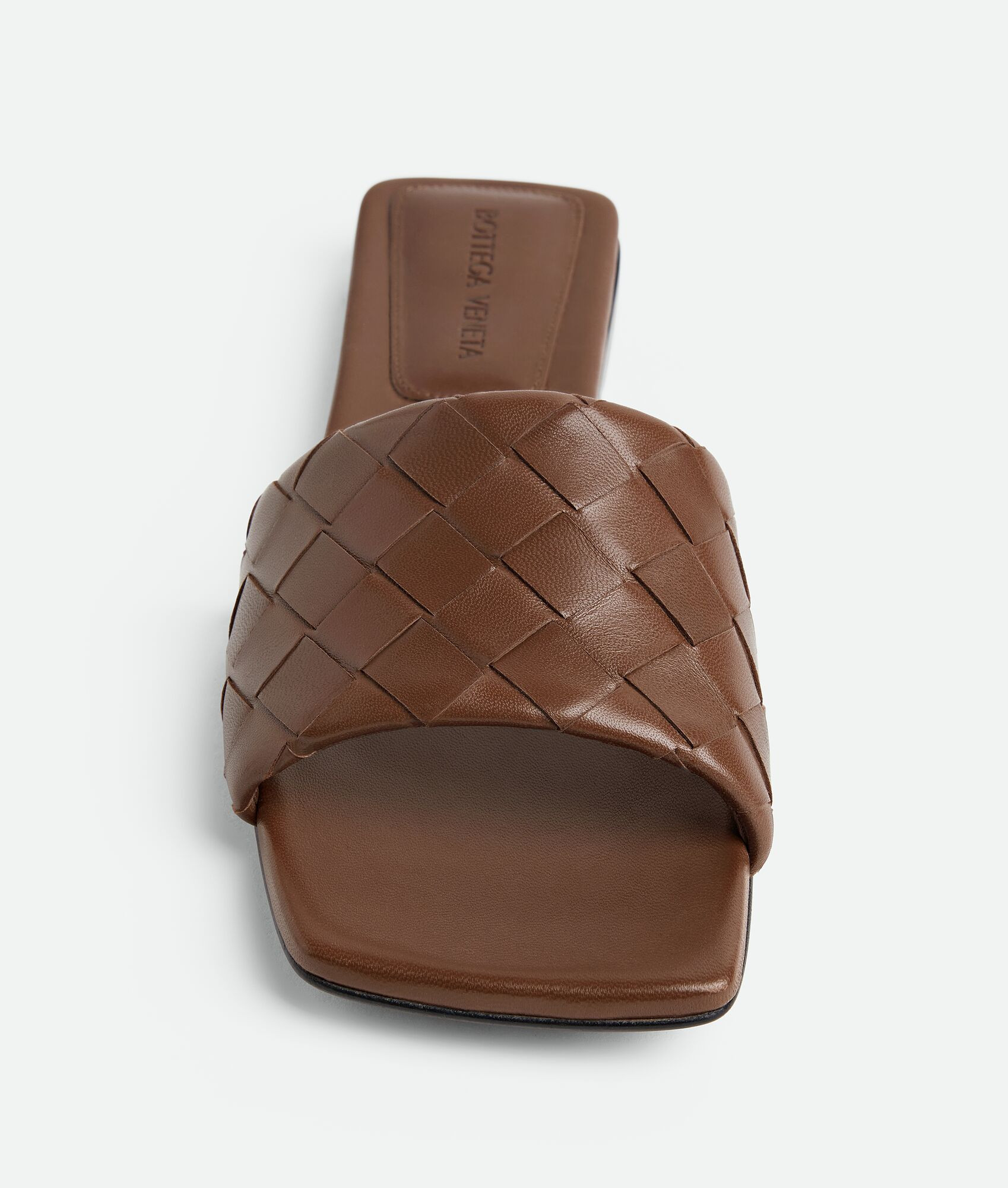Bottega Veneta® Women's Parco Flat Mule in Dark leather. Shop online now. | Bottega Veneta