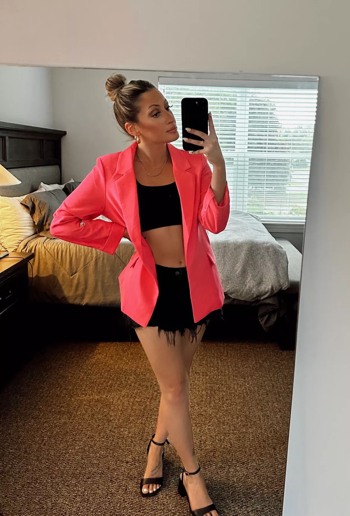 Red blazer and black shorts