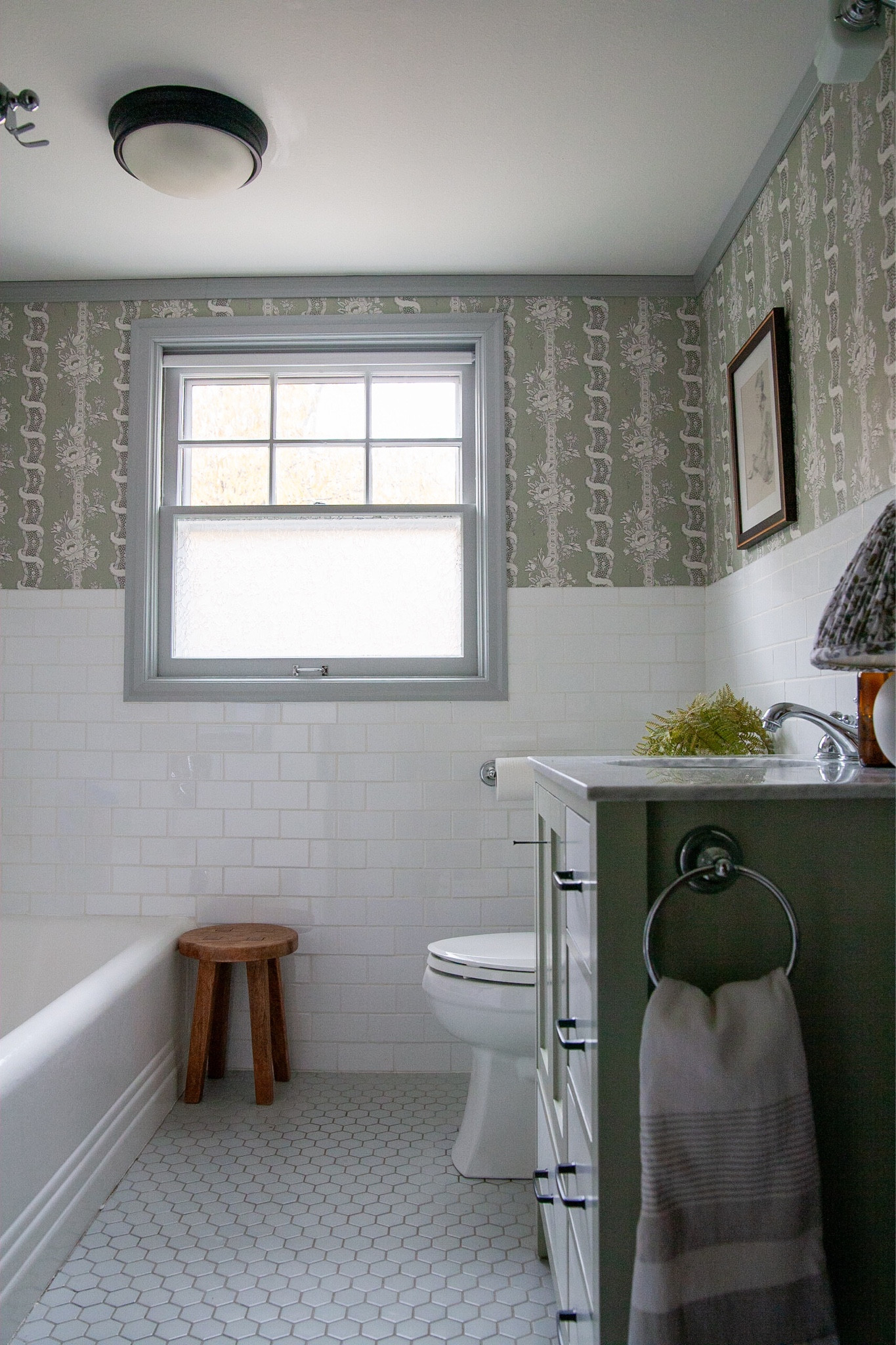 Almost all of you voted for the plums, and I was totally in that camp too until then one day… I dunno, I changed my mind!
I powered through wallpapering this bathroom yesterday morning and it is my best wallpaper job yet! It is so fun and exciting to walk into this room and see this beautiful pattern and color. This is the Alexandra wallpaper from Sandberg Wallpaper.
I put back a couple pieces of art but I’m not sure, what do you think, I loved all the art in here but now that I have this pattern, I’m not sure if I need it. Should I put more of those vintage frames back?? Being careful with how many holes I poke. (The mirror is not back yet and I’m not finished painting the vanity, and I have a few other changes planned too.)

#LTKhome