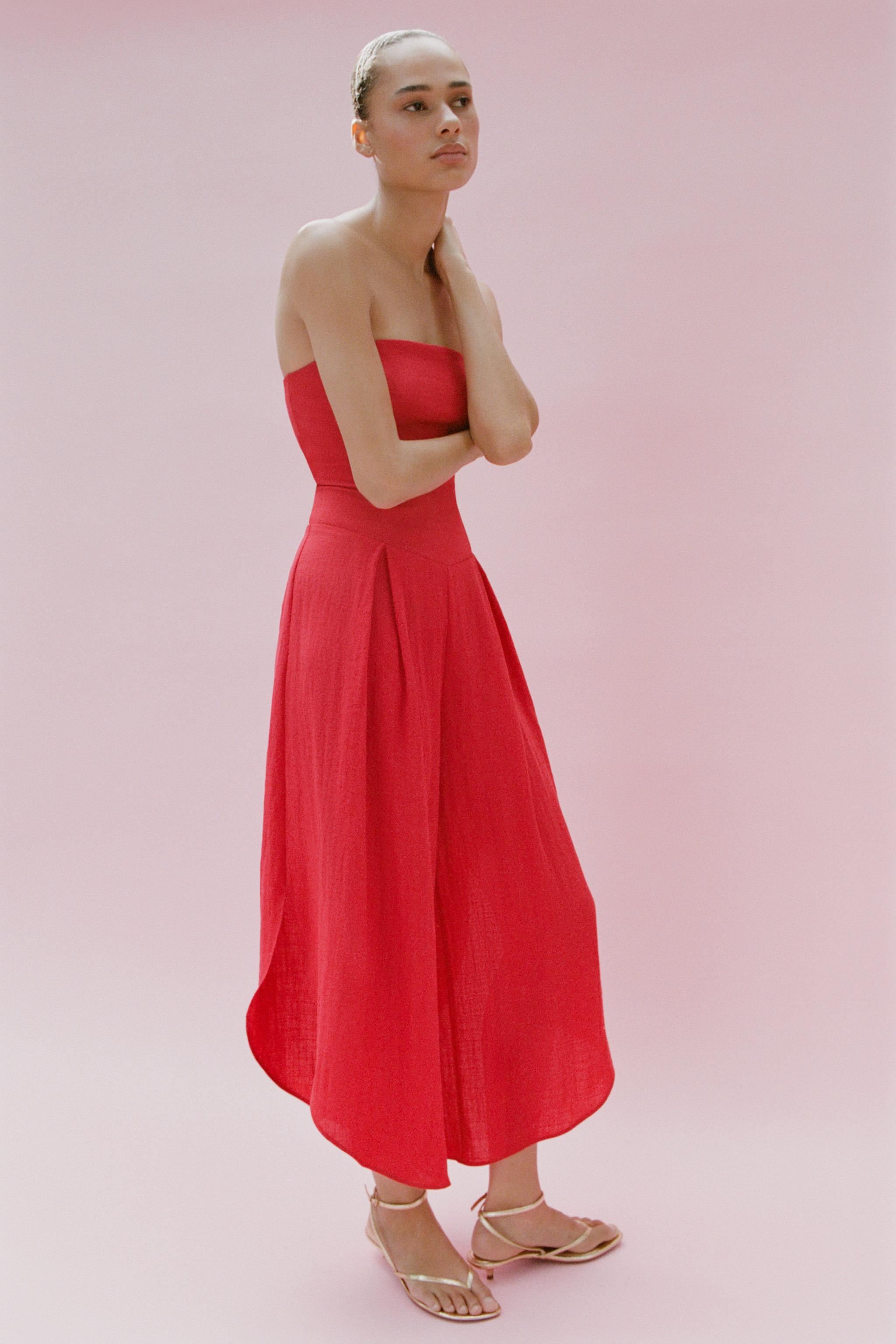 Straight-neck, off-the-shoulder jumpsuit. Wide leg with an asymmetrical hem. Elasticated smocked ... | Zara US