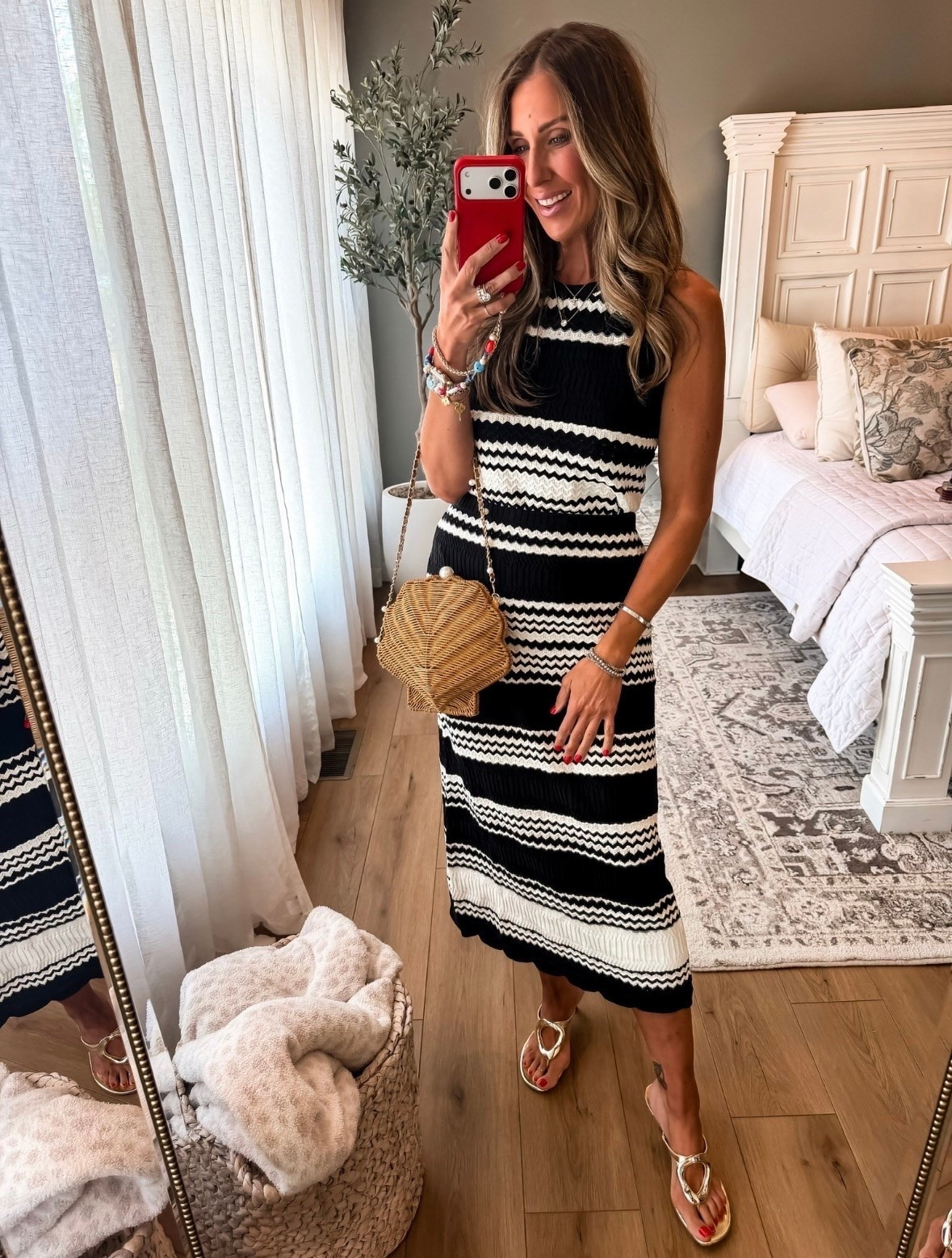 This black and white knit midi dress is one of those pieces that looks instantly put together with minimal effort. I paired it with gold sandals and a woven shell bag for an easy summer look that works for vacation, dinner, or a weekend outing.

Black and white dress, Knit midi dress, Summer vacation outfit, Resort wear, Vacation style, Woven handbag, Gold sandals, Chic summer outfit, European summer style, Vacation dress, Date night outfit, Summer fashion, TheMomInStyle

#LTKootd #LTKOver40 #LTKTravel