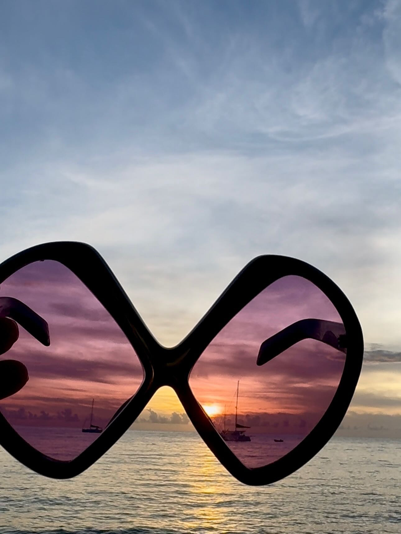 Last of summer from here. 

Rose tinted windows I can get behind.  Literally 🌹 
I wore this dress on repeat as is and over skirts (see yesterday’s post) ✌🏾
The sunsets hit different there 🌞 
The biggest sweet pototoe ever. A lie.  There was bigger at the supermarket 🥔 
Michael picks coconuts from our tree with my step father
Last of the sun for now 🥥 
Fishermen in Gros islet 
One day I want to try bare back horse riding.
Yes I brought the fish bag.  It’s giving Jacquemus SS26 but make it island style 🐠