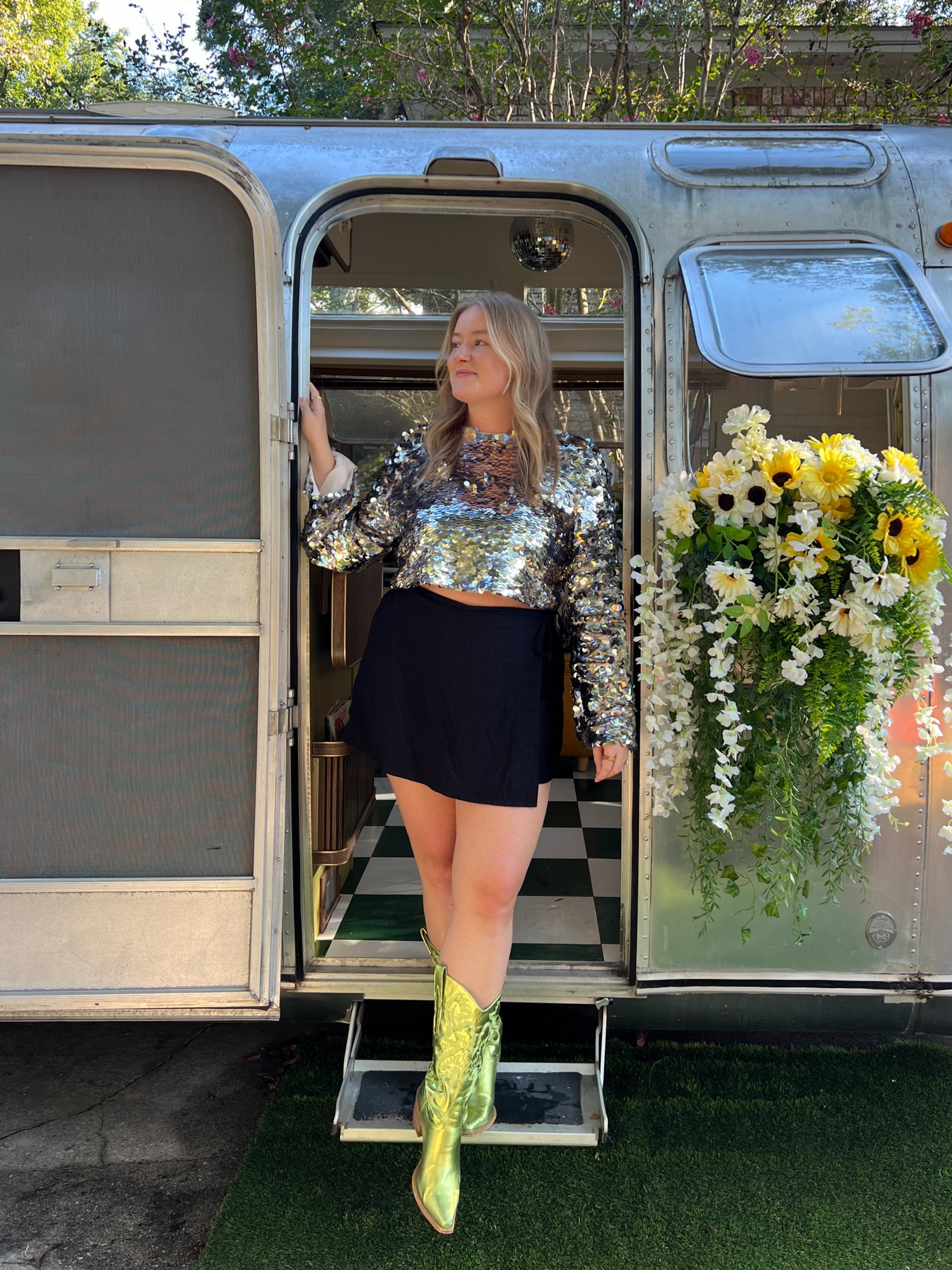 black wrap skort, sequin long sleeve crop top, metallic cowboy boots, concert outfit, midsize style 

#LTKStyleTip #LTKMidsize #LTKFindsUnder50