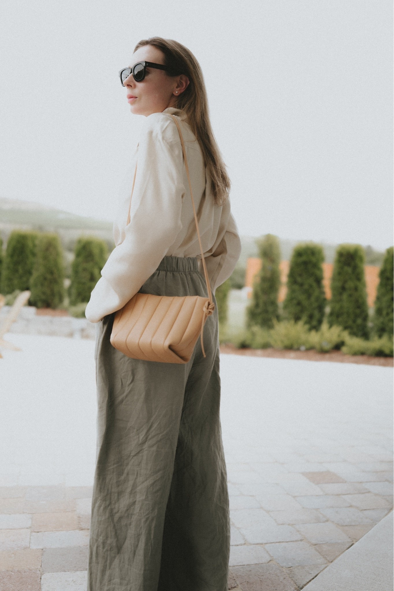 Vacation outfit but make it chic: linen pants + silk blouse + mini bag.
Blouse: @Lily Studio 
Bag: Maeden

#LTKSeasonal #LTKootd #LTKTravel