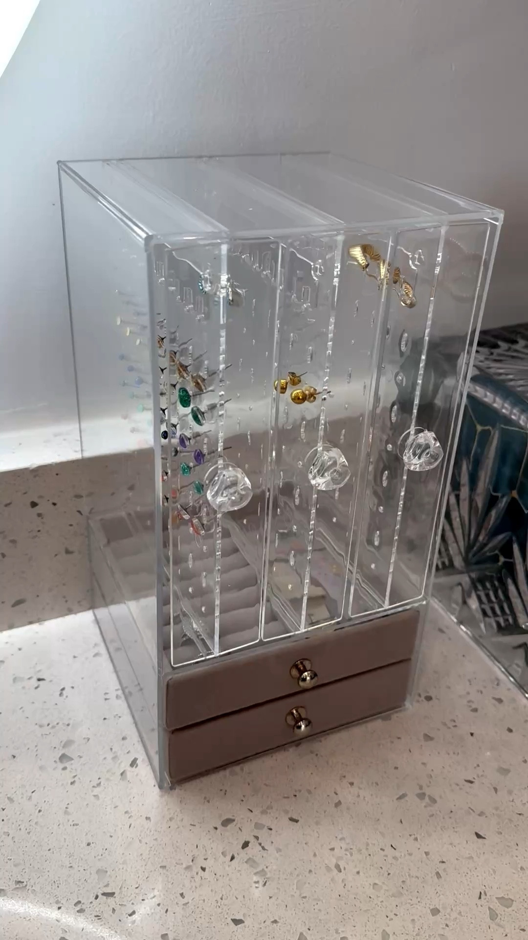 I need organization, and throwing my earrings into a small dish made it time-consuming to pick out the desired colors. This was an amazing deal that checked all my boxes. I chose the five-drawer option instead of the three because I like having the two bottom pullouts to store other accessories that were lying around. The cabinet is lightweight—I wish it were made of thicker acrylic, but since I’m gentle with my things, it should last quite some time.

Now, let’s talk about these earrings. They were a great find on Etsy. I’ve ordered three times from Karlyn B Designs. It was recommended that I buy titanium-backed earrings by my piercer because I was experiencing irritation. I searched on line and came across these; the colors match exactly as shown. They come with two different backs, stainless steel and clear silicone. I use the silicone ones. That’s why I bought an extra box of silicone backs-because I tend to lose them now and then. 

HOC springs: feel free to reach out and ask about earring colors. I’m happy to help you pick some! i’ve tagged most of the colors that are in the jewelry cabinet. ￼

#LTKHome #LTKselfcare #LTKSaleAlert