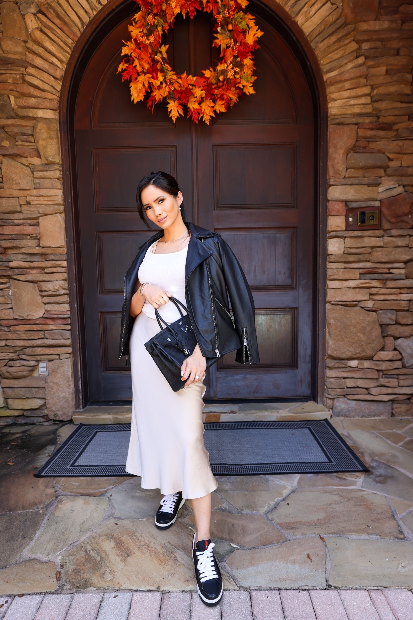 Leather jacket with a silk skirt!!! This is giving me GREESE vibes but what a classic!!! Great outfit for Fall 2022!!! 

#LTKstyletip #LTKshoecrush #LTKfit