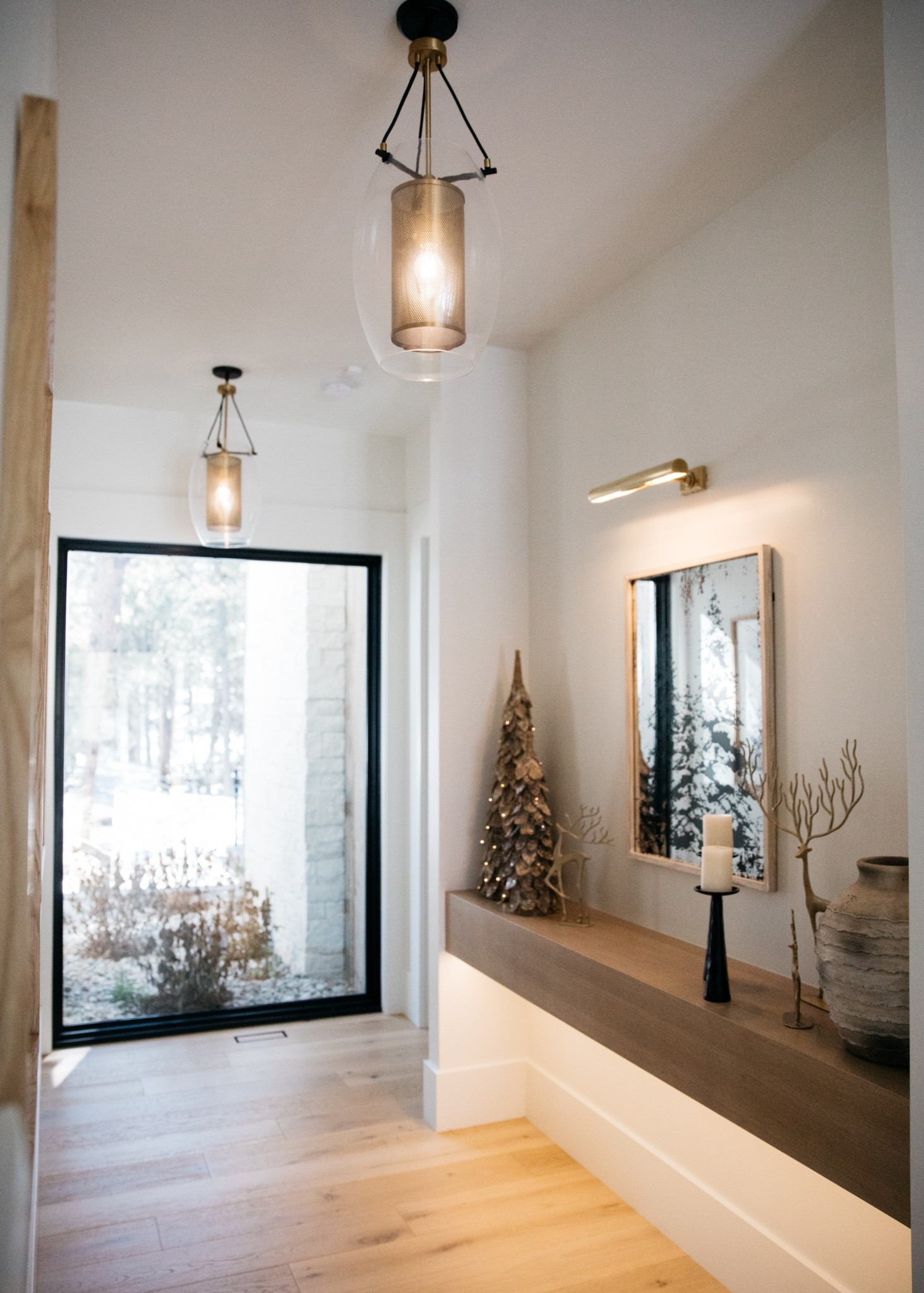 Christmas decorations in the hallway. The Lit Birch Trees are so versatile and add an extra touch of dimension to each space. The Antique Trees mirror is no longer available. I got it several years ago.

#LTKSeasonal #LTKHome #LTKStyleTip