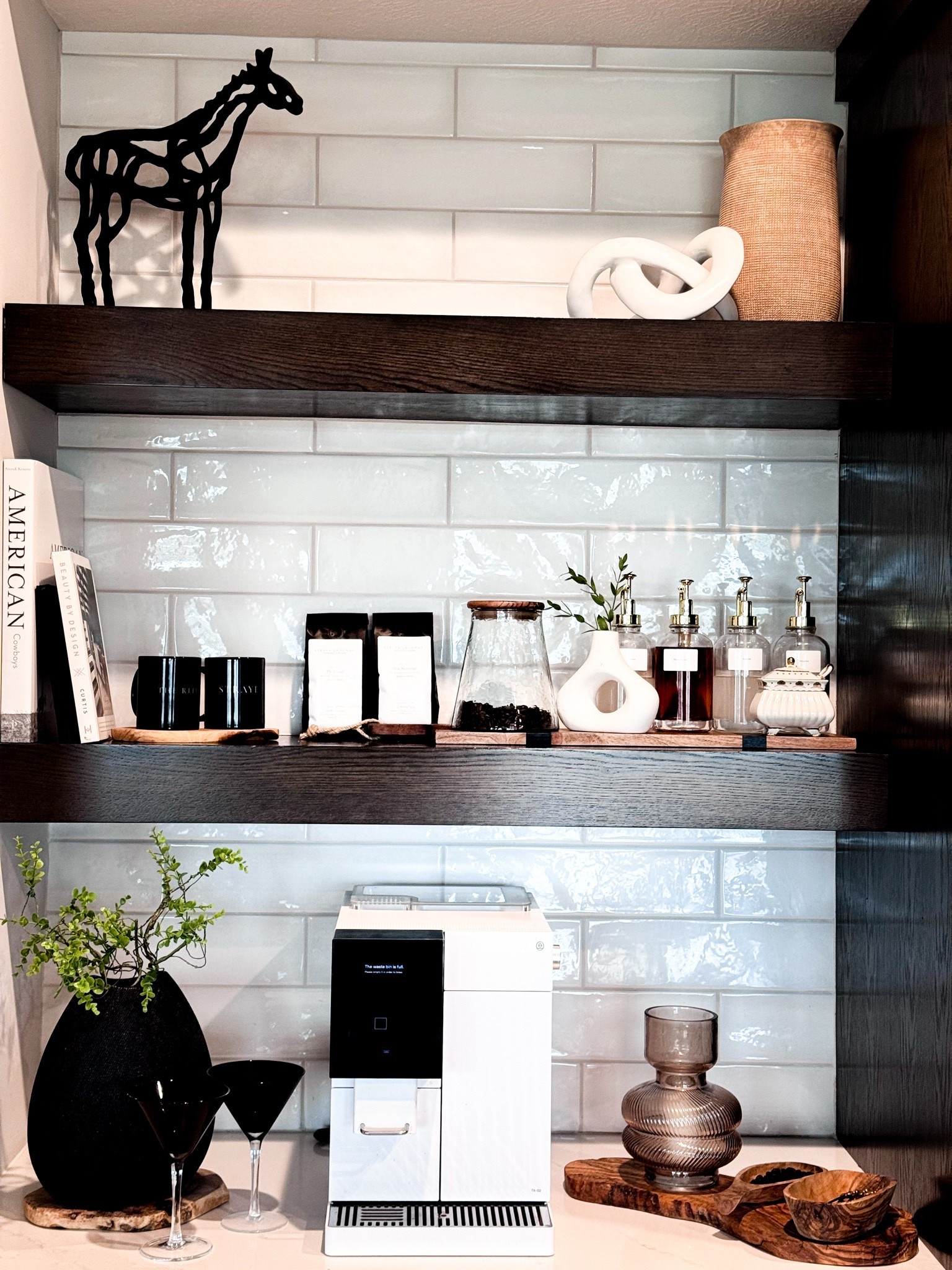Elevated Coffee Bar Styling

An elevated coffee bar setup with a mix of functional pieces and styled accents — espresso machine, glass syrup dispensers, wood trays, ceramic decor, coffee mugs, and warm neutral textures.

I love keeping the pieces practical, but styled enough that the whole corner feels intentional.

coffee bar, coffee bar decor, home coffee bar, espresso bar, kitchen styling, neutral kitchen decor, coffee station, espresso machine setup, glass syrup dispensers, wood tray, coffee bar accessories, modern coffee bar, elevated coffee bar, shelf styling, kitchen counter decor

#LTKHome