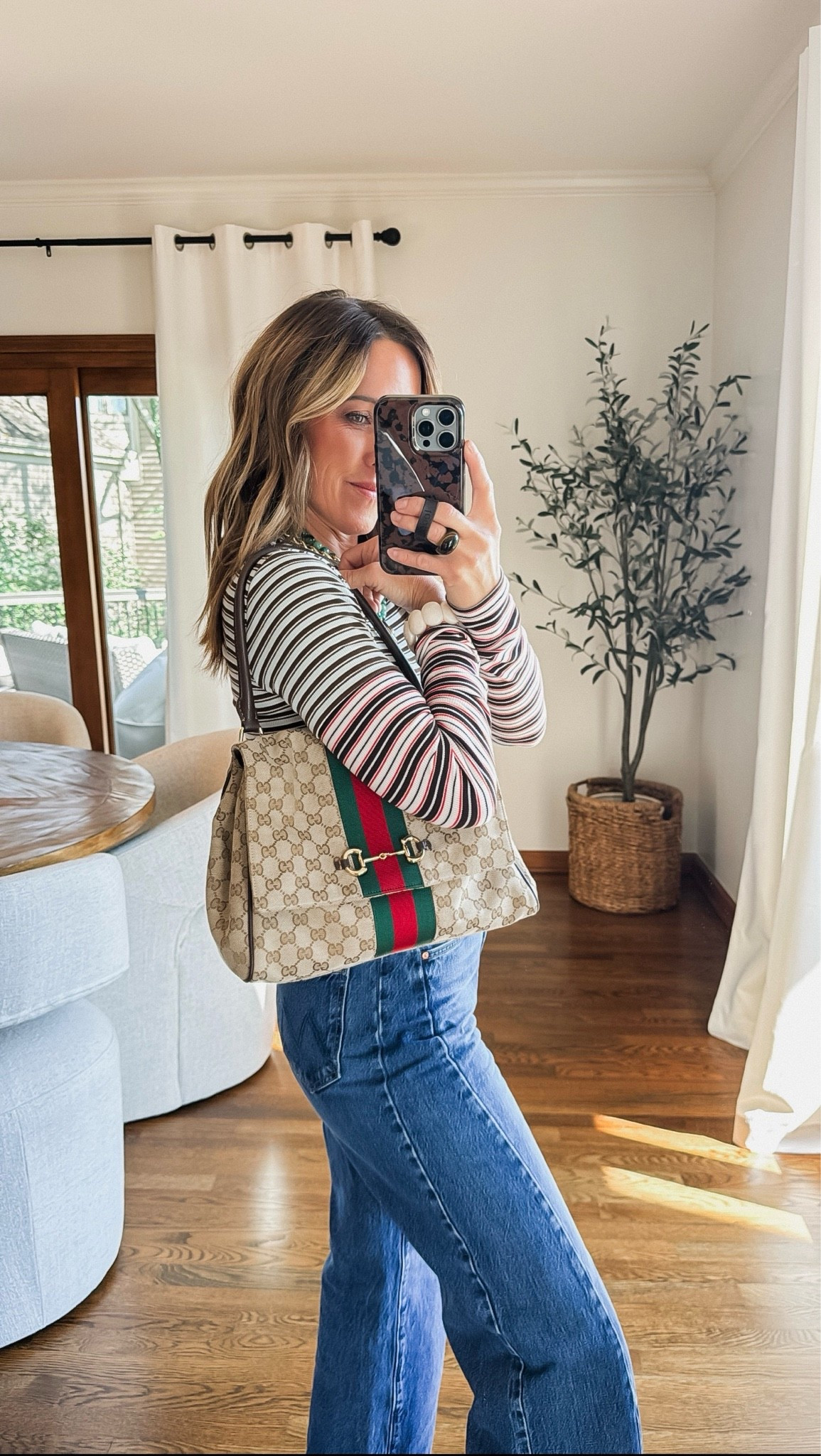 Love this double layered tee!! So fun with the multiple stripes. 
XS 
Jeans tts, ankle flood length
Medium bag