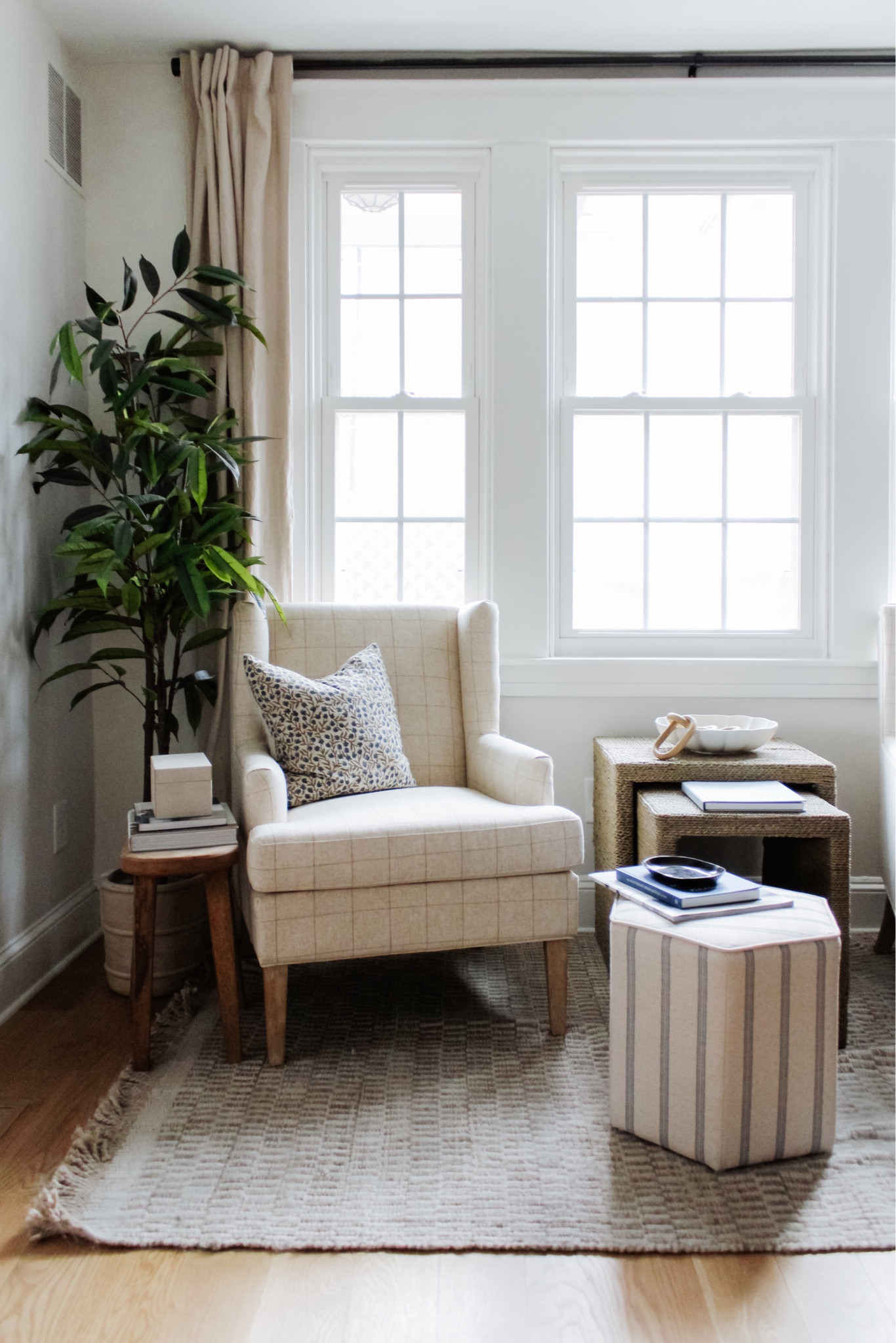 A space that I’ve neglected a bit - what’s yours? ✨ In case you missed it, I’m recapping the entire week over on stories. Now get offline and enjoy Easter, if you celebrate ☺️
•
Shop my home, find the latest deals and more all on my blog. Message me with any questions!
•
•
•
Sitting room, reading corner, faux tree, woven end table, ottoman, pouf, jute rug, affordable curtains, accent chair, throw pillow, spring decor 

#LTKhome #LTKsalealert #LTKunder100