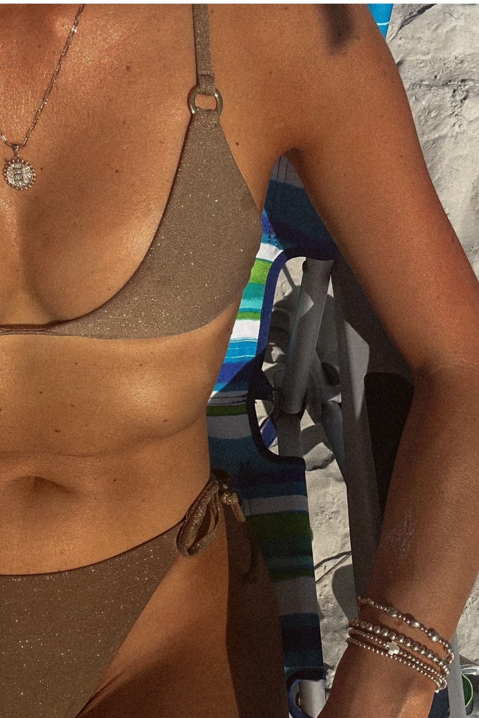 bronze bikini | size small top & medium bottom 

everything but water | gold swimsuit | bronze swimsuit | sparkly swim | neutral swimsuit | string bikini | summerful | beach | ootd | summer | vacation | tulum triangle bikini top | Cabo Brazilian bikini bottom 

#LTKFind #LTKunder100 #LTKswim