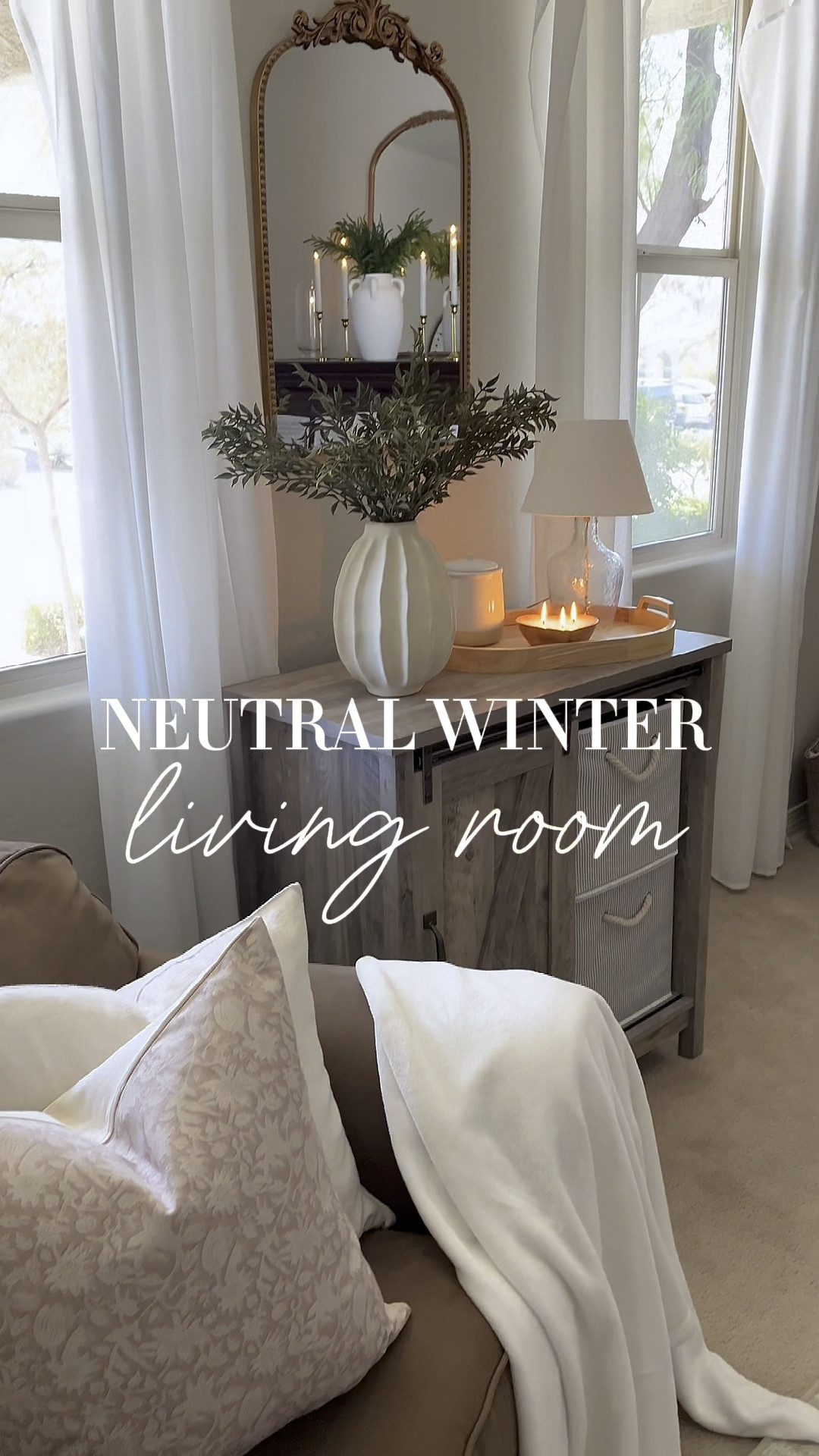 Neutral winter living room!  Follow @lifeinmyarizonahome on Instagram for more inspiration. 

I found these stems that are perfect for winter and I’m loving this beautiful wavy vase.   I kept things pretty simple and neutral in here after the holidays and I enjoyed bringing in a touch of Valentine’s with this heart wooden bowl candle.

#LTKSeasonal #LTKHome #LTKWatchNow