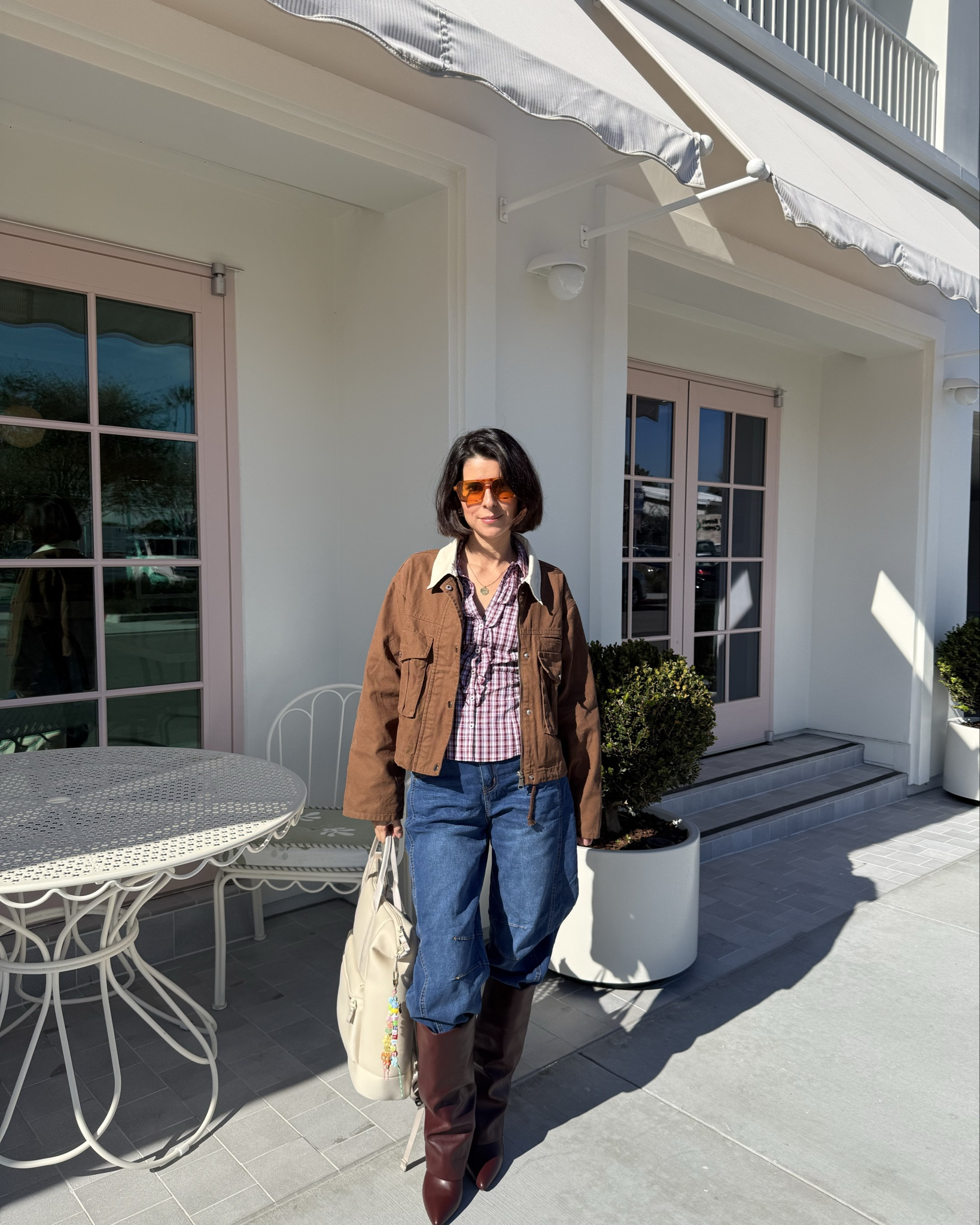 Text overlay:
Jacket: Amazon
Top: Hollister
Jeans: Free People
Boots: Amazon
Bag: Target

#LTKPetite #LTKgrwm #LTKootd