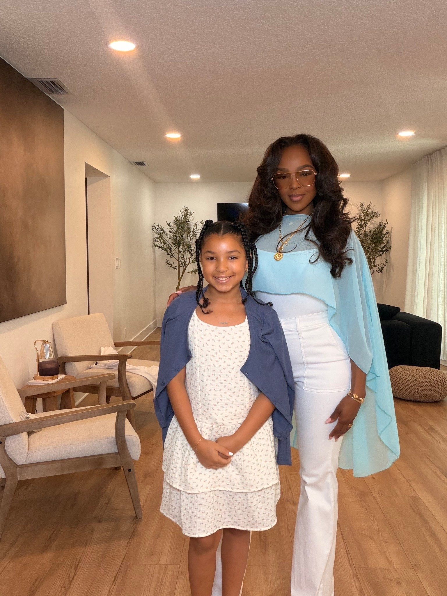 Mommy & me but make it chic 💙

Soft blues, crisp whites, and elevated neutrals will forever be one of my favorite combinations for spring. This look feels classy, feminine, and timeless while still being comfortable enough for real life moments with your mini. The flowy cape detail paired with structured white denim gives such an effortlessly luxe feel.

Perfect for church, brunch, family photos, baby showers, Mother’s Day, spring events, or girls day with your mini.

Affordable elevated pieces styled in a way that feels designer-inspired without overspending. These are the kinds of timeless wardrobe staples you’ll keep reaching for season after season, making the cost per wear so worth it.

5’4 | 140LBS | 34D-27-40 | size small or 4

Mommy and me outfits, spring family outfits, church outfit ideas, classy spring fashion, feminine outfit inspo, elegant casual outfits, white denim outfit, soft blue outfit ideas, elevated mom style, luxury inspired fashion, brunch outfit women, spring event outfit, chic everyday style

Follow me on Instagram and YouTube @kirasfashionfinds