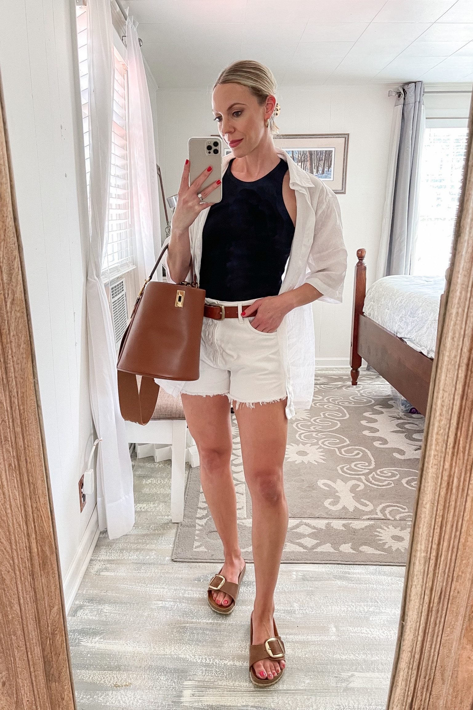 Classic summer style, black and white summer outfit, white linen shirt, white denim shorts, Madewell leather belt, Birkenstock sandals 

#LTKstyletip #LTKshoecrush #LTKunder50