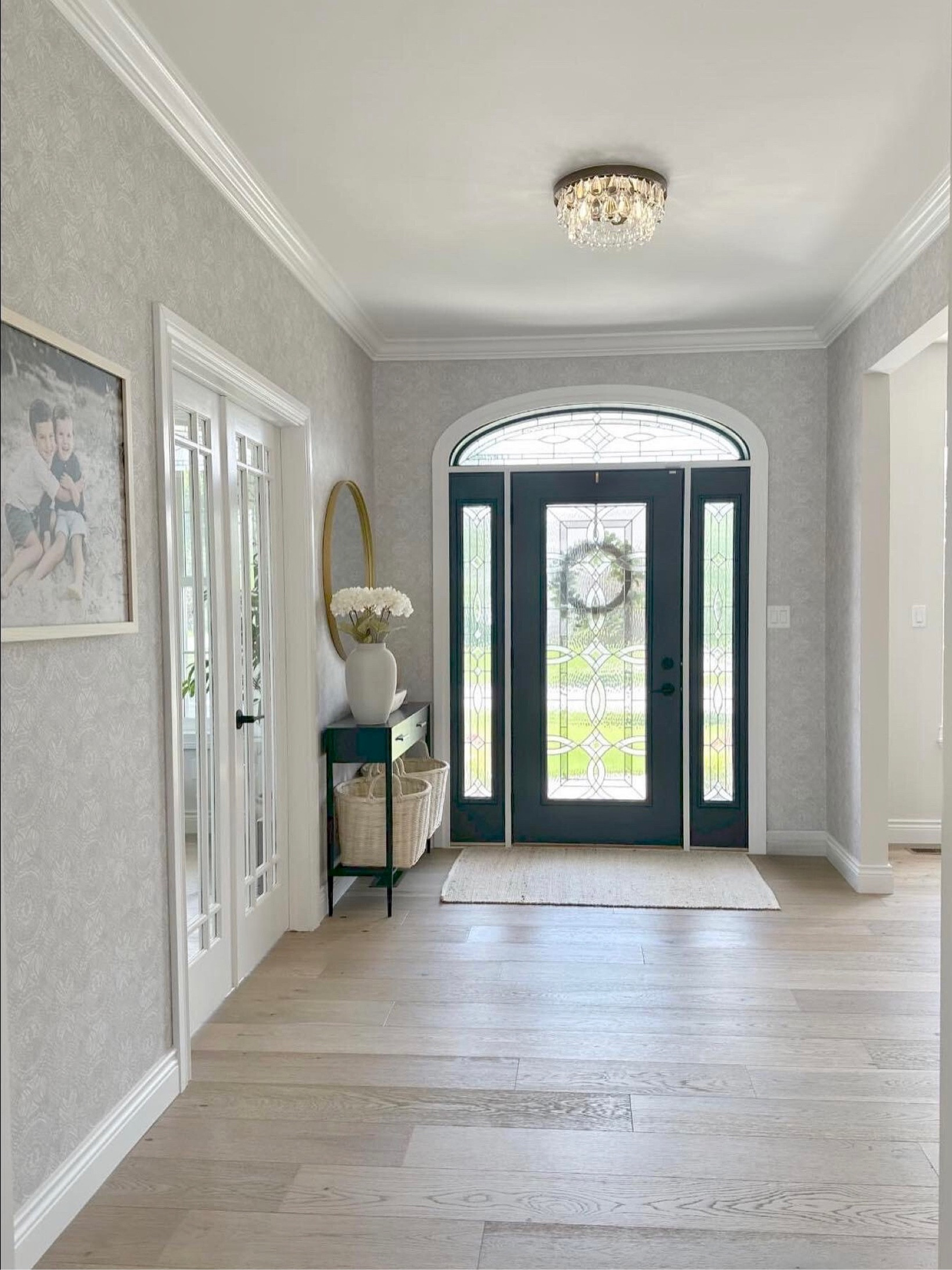 A gorgeous foyer remodel!  Wallpaper, lighting, and the well styled foyer table are all great options to incorporate to upgrade your own foyer!

#LTKhome #LTKfamily