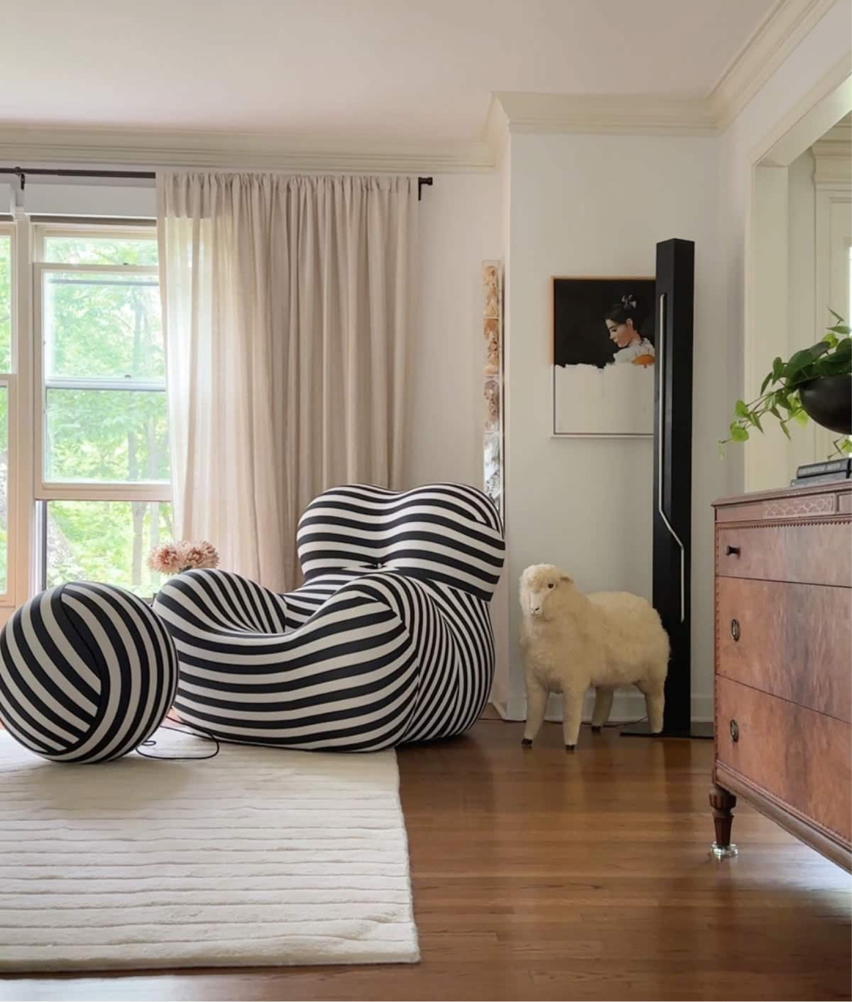 If you love funky, weird furniture, you best press follow! This black and white striped chair just landed in the living room and I’m a smitten kitten. To balance out the modern, I paired it with a few pieces of vintage decor - the sheep ottoman and postmodern neon light. 

Vintage decor, funky furniture, weird decor, black and white striped decor, modern eclectic decor, funky chair, weird chair, black and white chair 

#LTKStyleTip #LTKHome