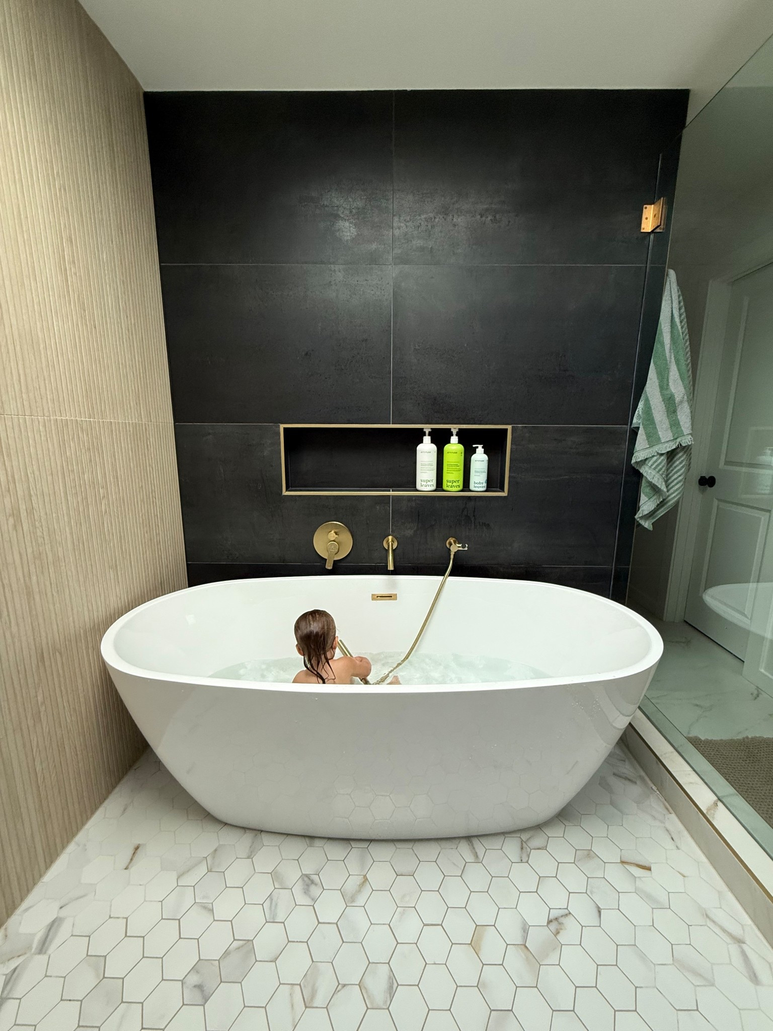 The tub/shower combo has been such a hit for the fam & makes things just a pinch easier with all the kids! ✨ All the tile is from floor and decor! 

#LTKHome #LTKFamily