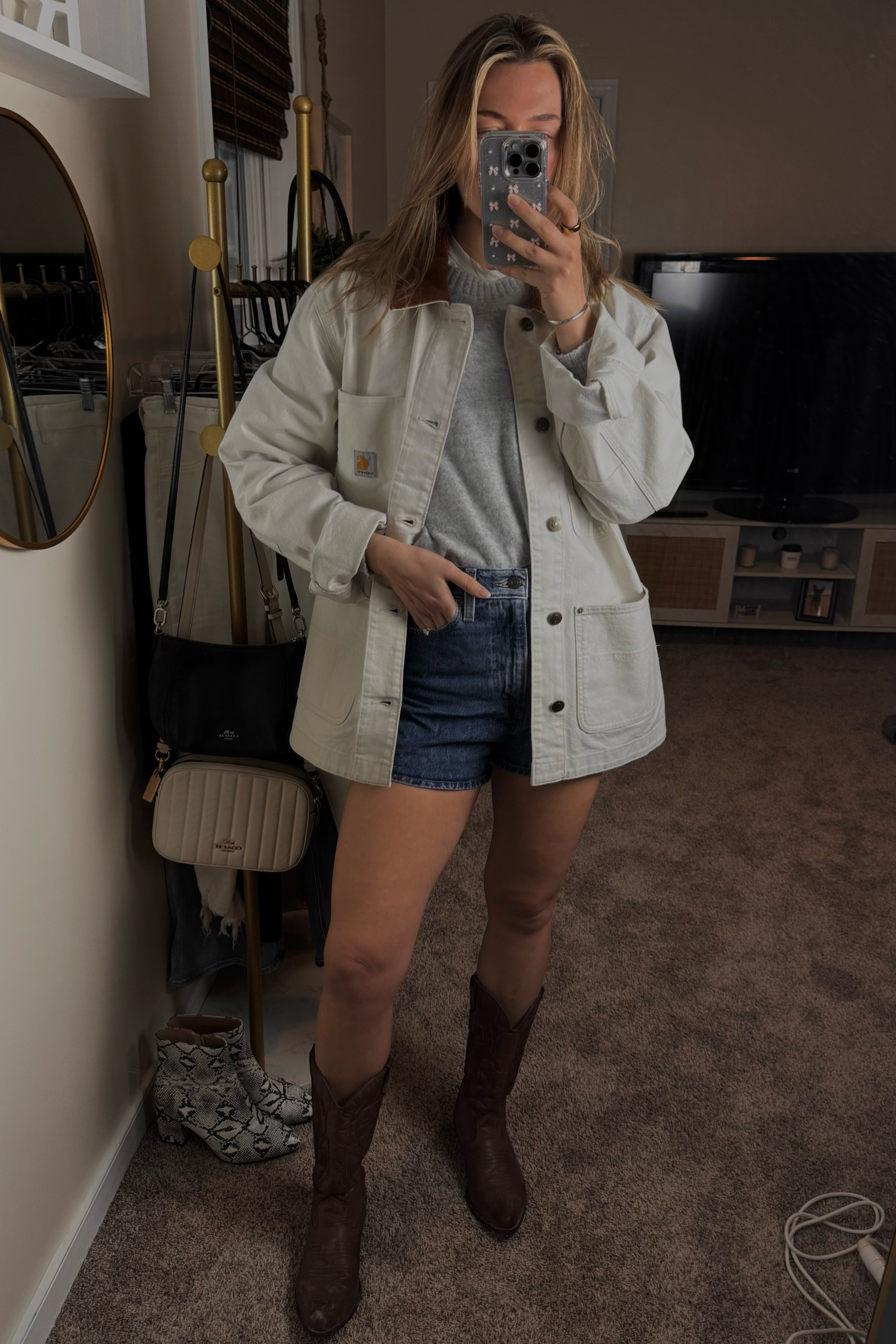 Elevate your winter look with this perfect layered outfit! ❄️ The Carhartt chore coat adds that rugged edge while keeping you warm and stylish, paired with a cozy crew cashmere sweater for ultimate comfort. 🌟 A classic white tee adds a fresh, clean base, while Levi’s jean shorts keep it casual yet cool. Finish it off with the cafe-colored Tecovas boots for a touch of sophistication and durability. 💫 Whether you're running errands or heading out for a casual day, this outfit has it all! Shop these versatile pieces now and stay stylish all season long. 🛒 #WinterLayers #CarharttStyle #CashmereCozy #LevisShorts #TecovasBoots #CasualChic #LTKFinds #LayeredLook #WinterStyle

#LTKShoeCrush #LTKSeasonal #LTKStyleTip