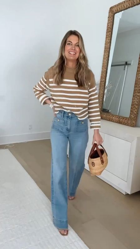 Wide leg trouser jeans! Size down if between - they stretch a bit with wear. I am 5’11” wearing my usual size (26 long) and pair them with a heel.  Small striped sweater. Xs tee. Sandals true to size.  

#LTKsalealert #LTKover40 #LTKVideo