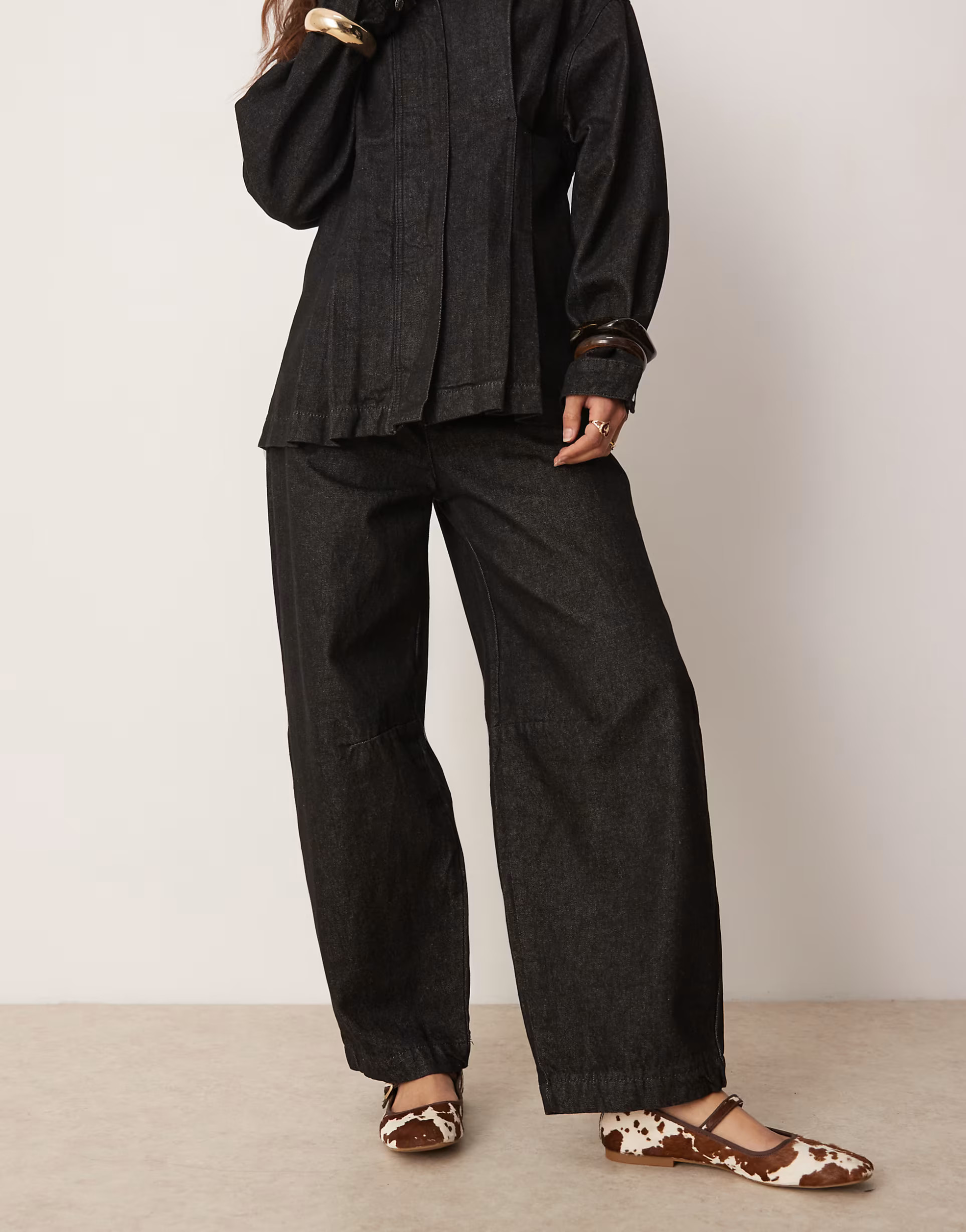 ASOS DESIGN arch leg trousers in black | ASOS | ASOS (Global)