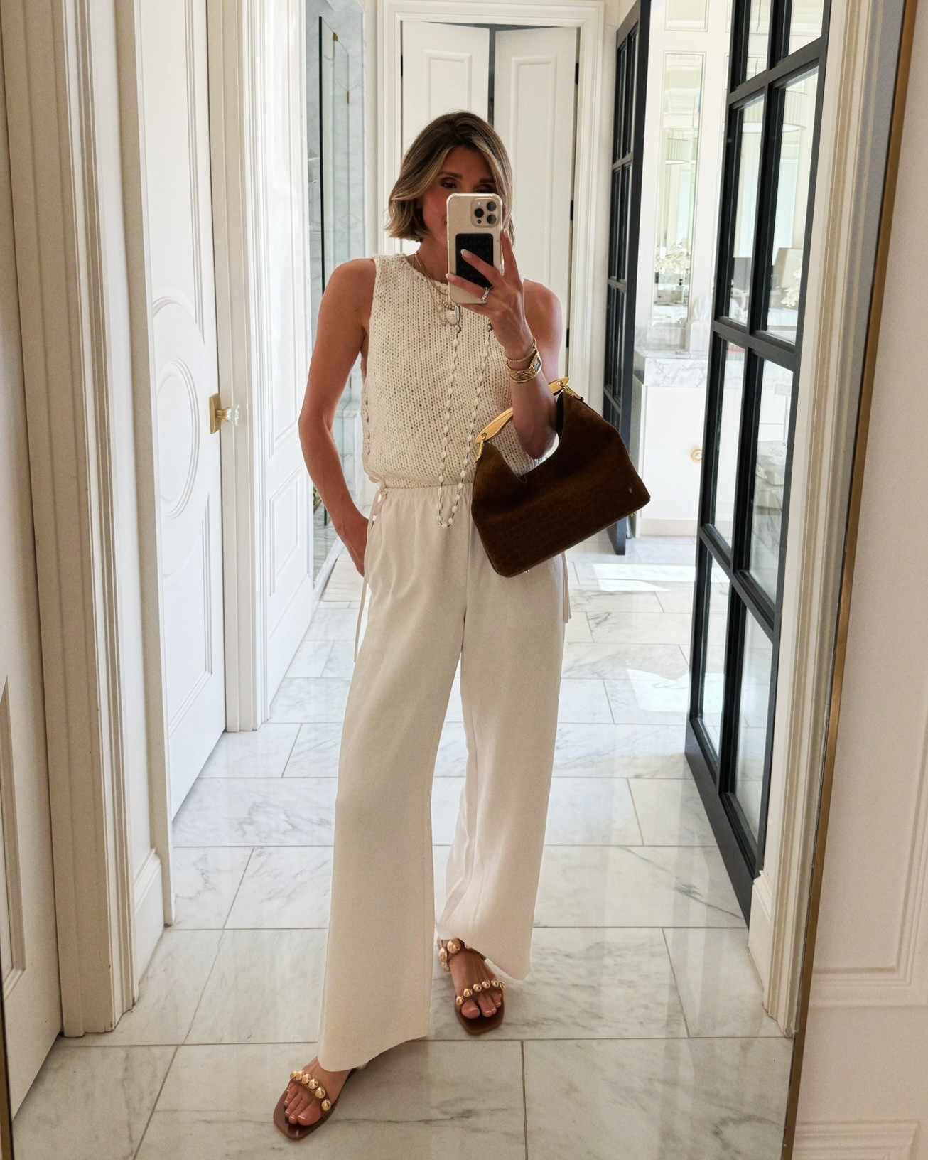 Love this sleeveless summer sweater - paired with the viral @Aritzia pants that fit true to size.

#LTKsummer #LTKstyletip