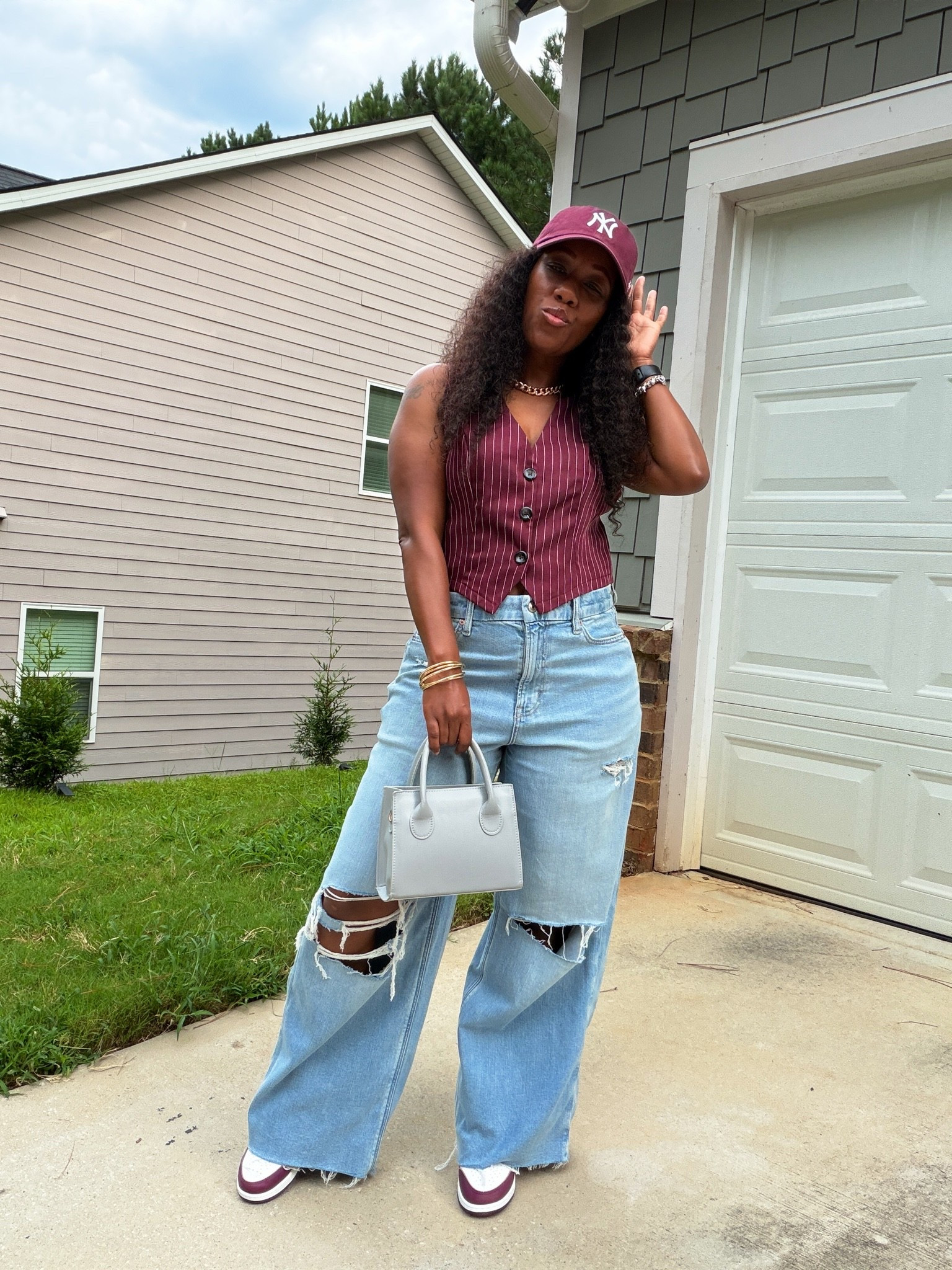 A burgundy vest and baggy jeans make such an easy outfit for transitioning into fall. I styled this burgundy pinstripe vest with light wash distressed jeans, matching burgundy sneakers and a baseball cap for a casual fall outfit with a sporty feel. If you’re looking for burgundy outfit ideas, vest outfits or ways to style baggy jeans this fall, save this look for inspiration. Shop my outfit on LTK.

#LTKootd #LTKPetite #LTKOver40