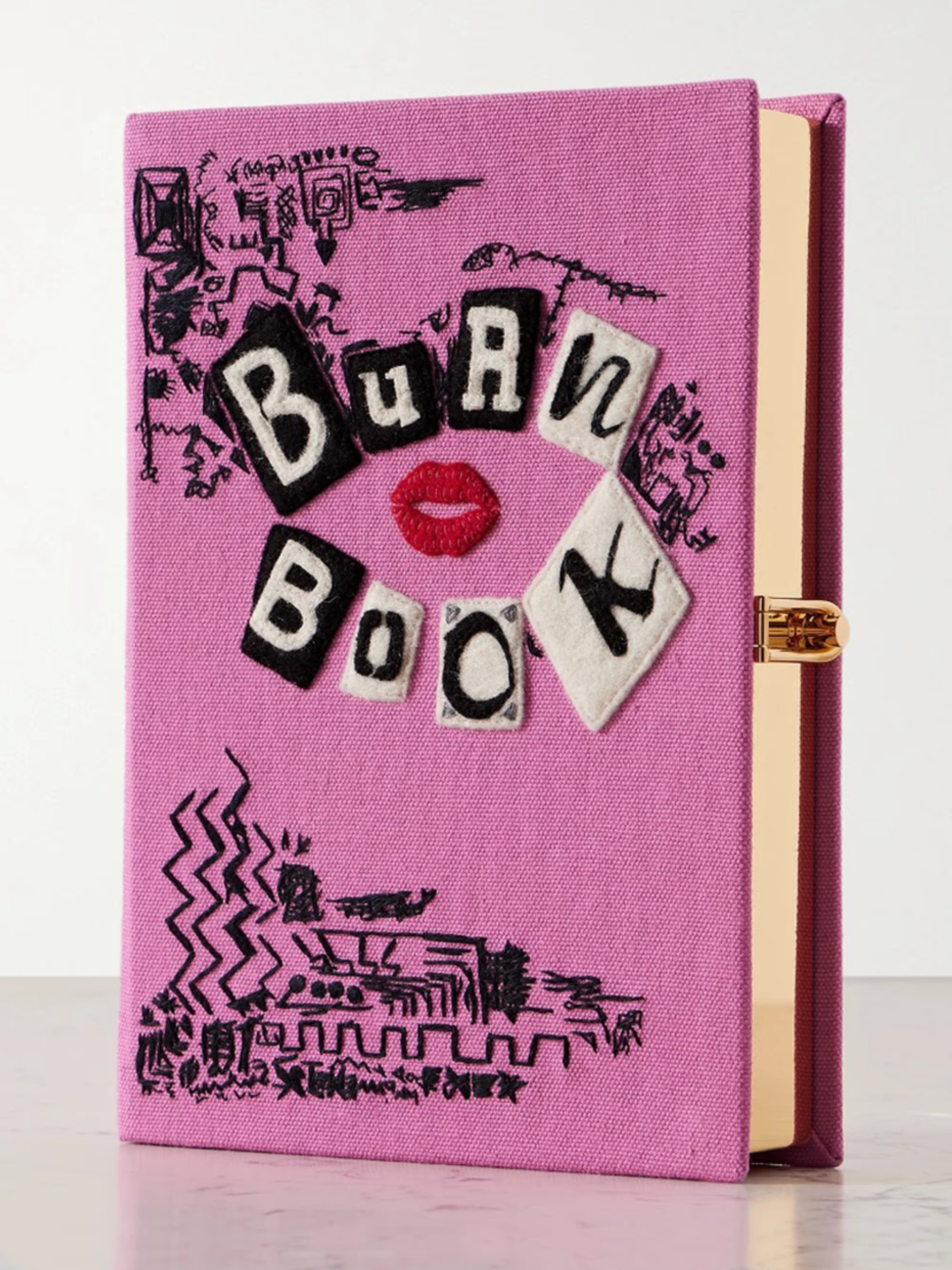 Mean Girls Burn Book embroidered appliquéd canvas clutch | NET-A-PORTER (UK & EU)