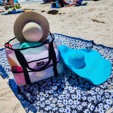 Best beach bag! I love this tote for any beach getaway! The design makes it easy for sand to fall out the bottom of the bag. Tons of exterior pockets, interior zippered pouch, and large interior primary storage area fits tons of things.

#LTKswim #LTKfindsunder50 #LTKstyletip