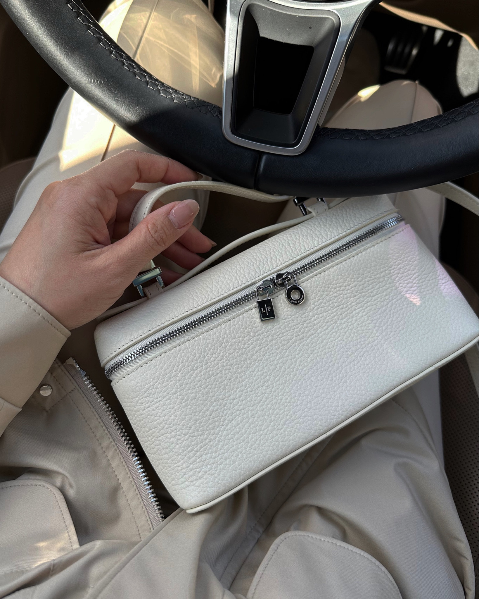 Loro Piana L19 bag is the most versatile little bag. It comes with a long strap for crossbody convenience and without the strap, it becomes a chic handheld clutch for the evening. For a small pouch, it holds all of my essentials including my iPhone Pro Max, cards, keys, sunglasses, lip balm, and hair clip. 

This style sells out each season, but it is a staple so keep on the lookout for restocks!

#LTKFind #LTKstyletip