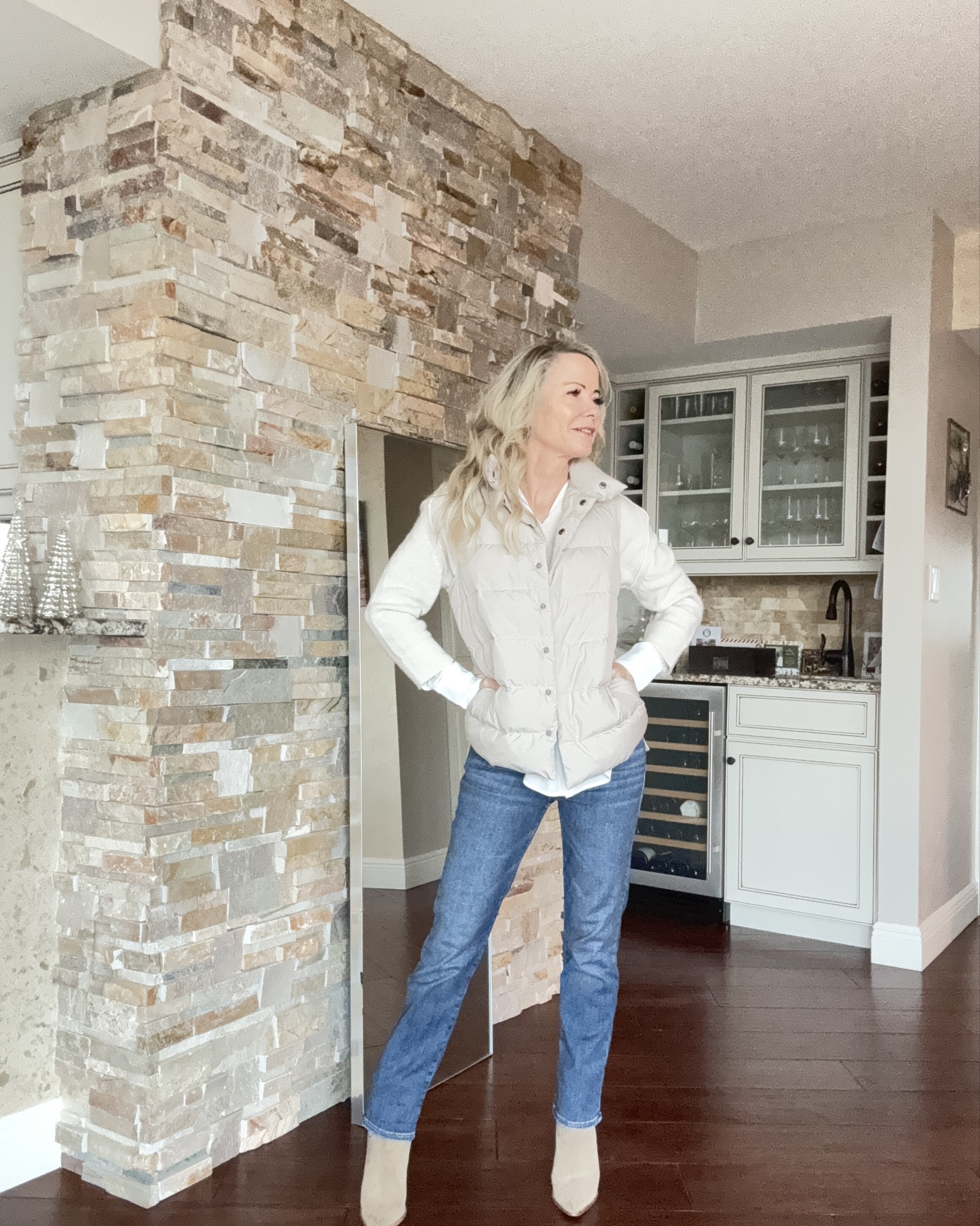 A chic neutral winter outfit featuring a lightweight puffer vest, classic button-down shirt, straight-leg denim, and suede boots. These pieces are perfect for everyday style, casual winter looks, and polished outfits for women 40+ and 50+. Shop exact pieces and similar options to recreate this elevated yet easy look.

#LTKStyleTip #LTKOver40 #LTKootd