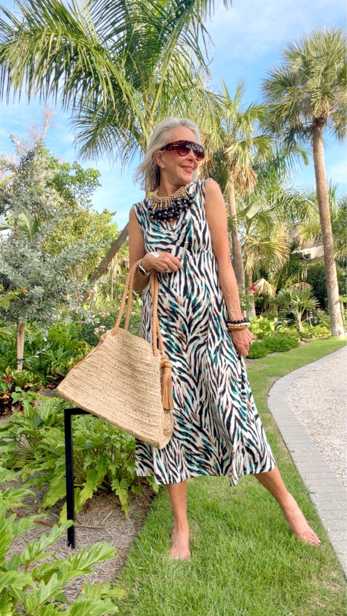 This dress is now Under $50. It is soft, flowy and it has a little turquoise in the print so I will also be styling it with turquoise jewelry.
Chunky statement necklace, straw tote bag and sun visor made in Bali by Romi the Brand.

#LTKOver40 #LTKWorkwear #LTKSaleAlert