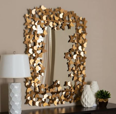 I love this butterfly mirror. I have it in a small hallway in my home. The gold butterflies are gorgeous. This mirror is heavy duty and worth every penny.

#LTKhome #LTKMostLoved #LTKGiftGuide