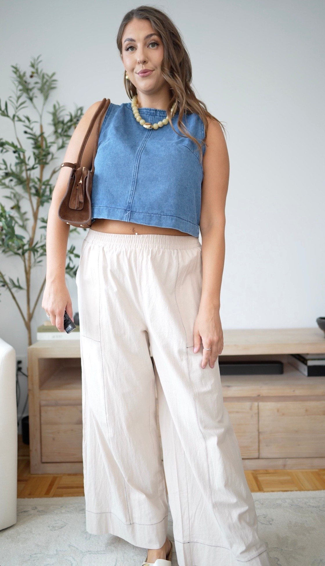 An easy summer-to-fall look with a denim crop top, relaxed cream pants, pearls and a chocolate brown bag. Casual, comfortable and still polished.

transitional outfit, denim top, cream pants, wide leg pants, casual chic, fall transition style, chocolate brown bag, pearl necklace, everyday outfit, effortless style

#LTKmomlife #LTKTall #LTKMidsize