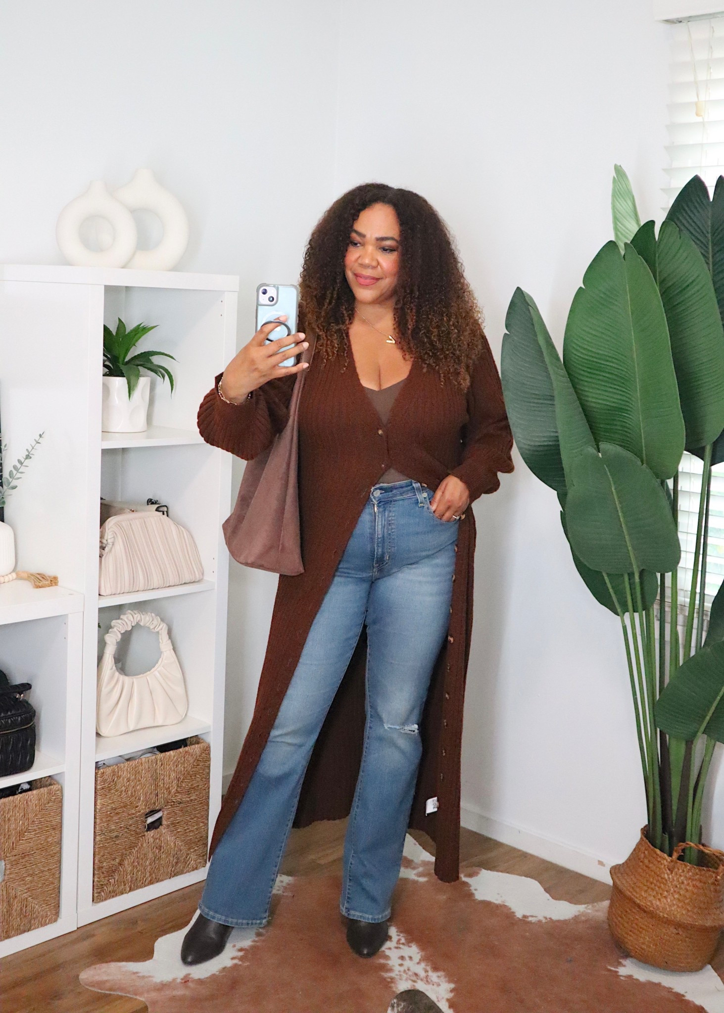 This duster cardigan is super cozy and versatile. Have it in two colors. Got a size large and it’s perfect. Bootcut Levi’s in a size 32. Honeylove cami is a size xl. 

Use my 20% off promo code link for the Honeylove cami -
Promo code link 🫶🏾 https://checkout.honeylove.com/VRODRIGUEZ  

#LTKMidsize #LTKootd #LTKOver40