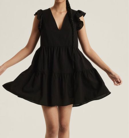 Black ruffle tiered midi dress 

#LTKSeasonal #LTKfindsunder50 #LTKstyletip