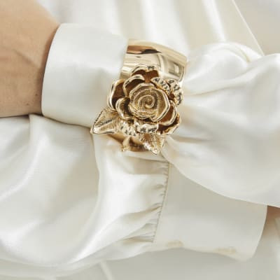 Gold Metal Flower Cuff Bracelet | River Island UK & IE