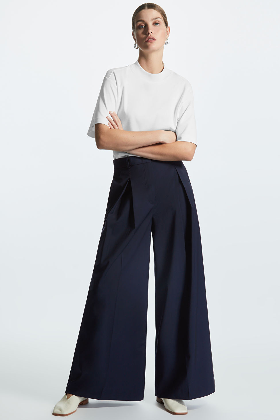 HIGH-WAISTED WIDE-LEG PLEATED TROUSERS - DARK NAVY - COS | COS UK