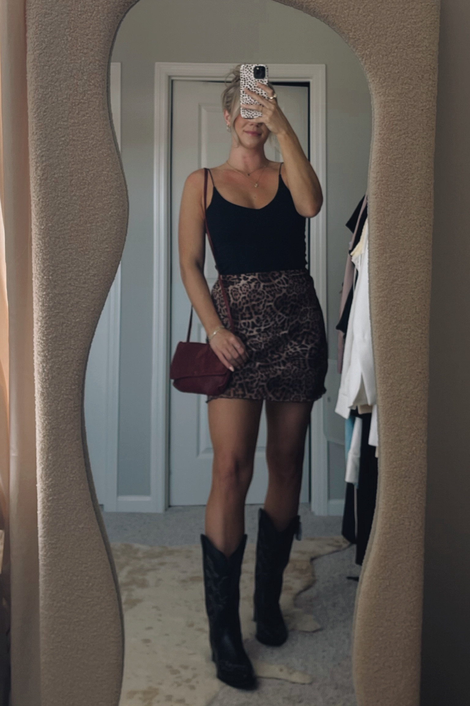 Cheetah skirt paired with cowboy boots perfect for a country concert. Skirt size is an 8 and fits perfect. Boots are size 10 which is a half size up from my normal size and there is plenty of room but not too much. Would recommend sizing up half a size. #LTKCountryConcert #LTKOutfit #LTKStyle