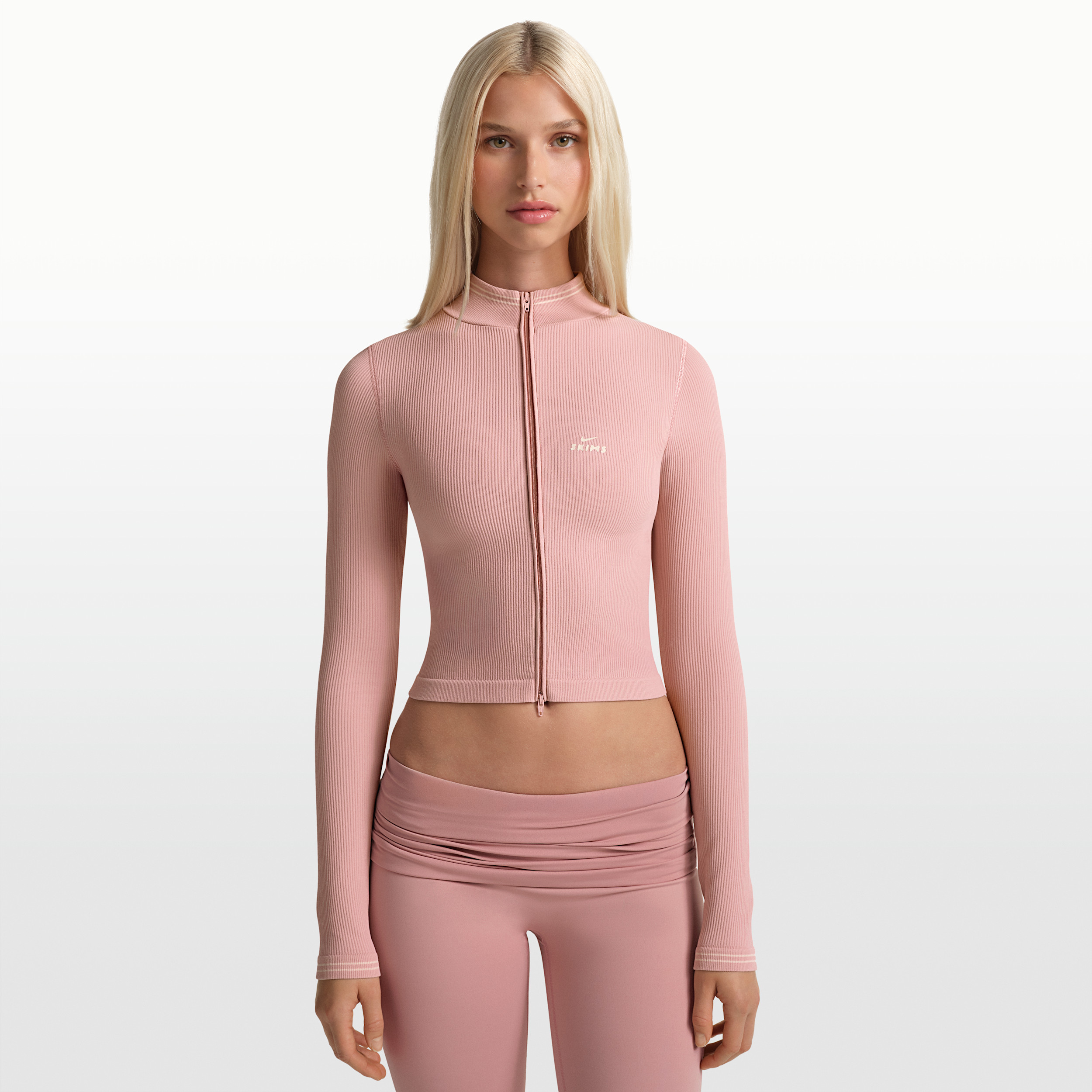 Nike Women's SKIMS Ribbed Seamless Cropped Full-Zip Jacket in Pink | TPLSL11145W-HEC | Nike (US)