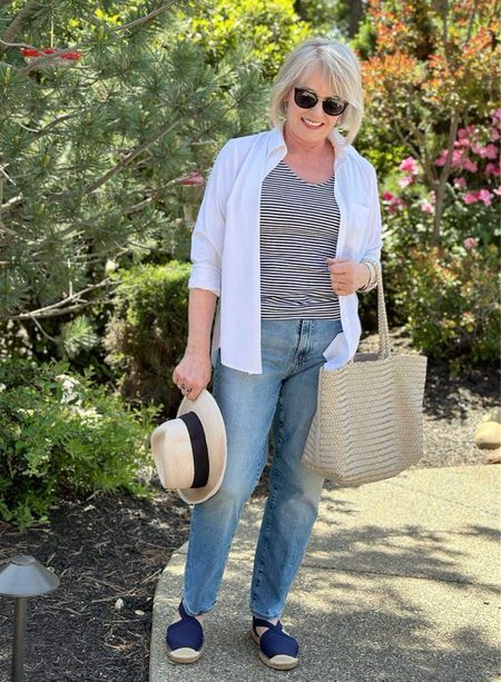 Classic white shirt over striped tank and straight leg jeans. Summer outfit coastal style 

#LTKOver40 #LTKStyleTip #LTKSeasonal