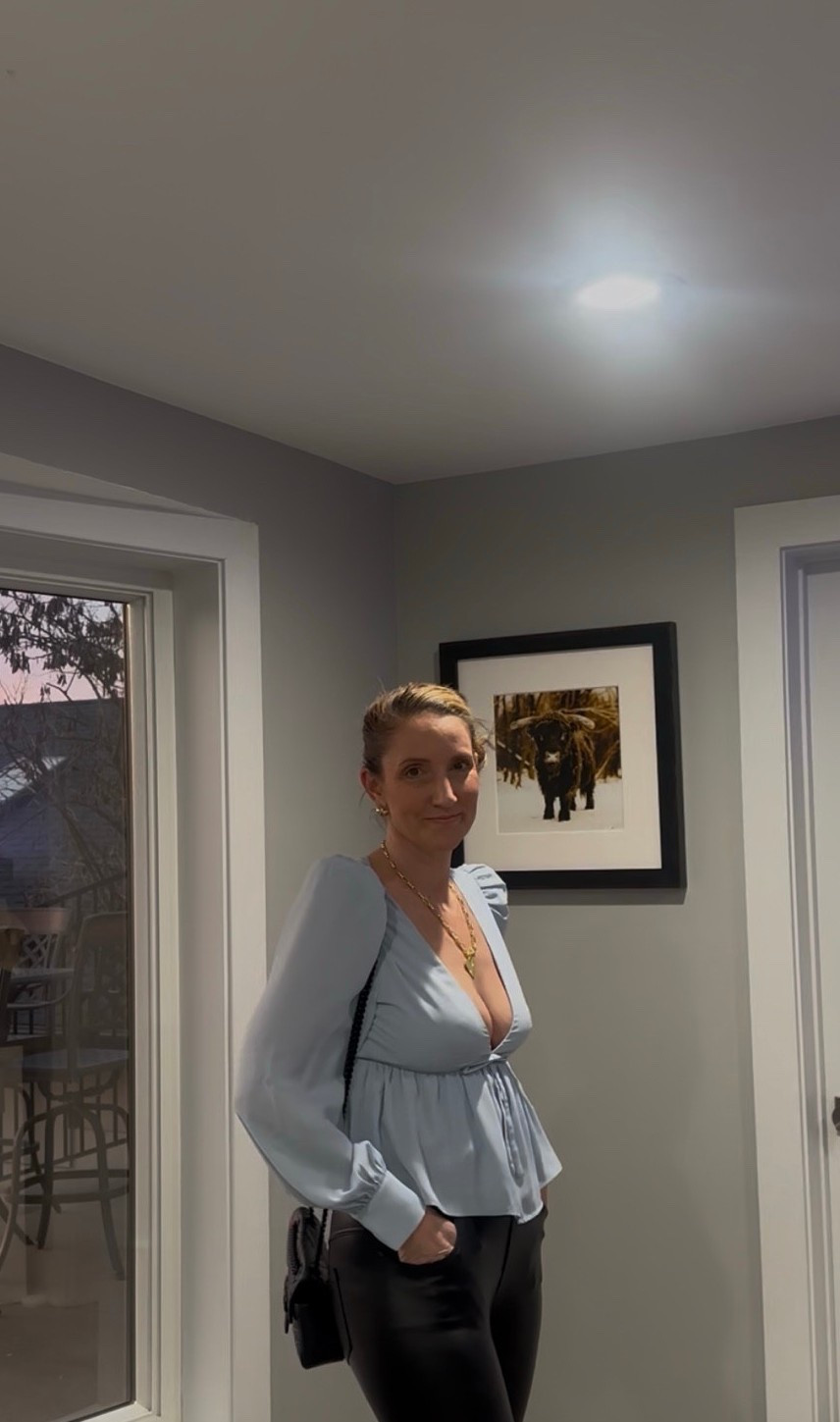 Casual Classic: For a more relaxed feel, I styled the top with dark-wash wide-leg jeans and a gold statement necklace. This is my favorite "weekend chic" uniform—comfortable enough for running errands but intentionally styled.

Baby blue satin babydoll top, black leather leggings, dark-wash wide-leg jeans, black velvet blazer, black bubble-hem mini skirt, versatile fashion 2026, "girly" aesthetic, puff-sleeve satin top, gold statement necklace, black quilted crossbody bag, LTKstyle


#LTKOver40 #LTKmomlife #LTKootd