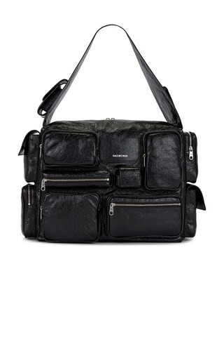 Balenciaga Superbusy Sling L in Black - Black. Size all. | FWRD 