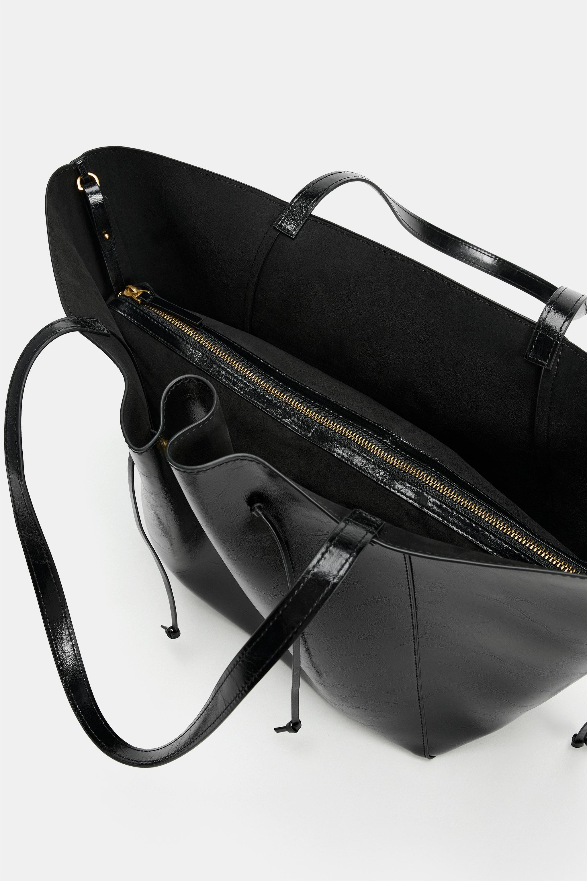 Tote shoulder bag. Gathered design with straps and metal detailing on the front. Side straps. Rem... | Zara UK