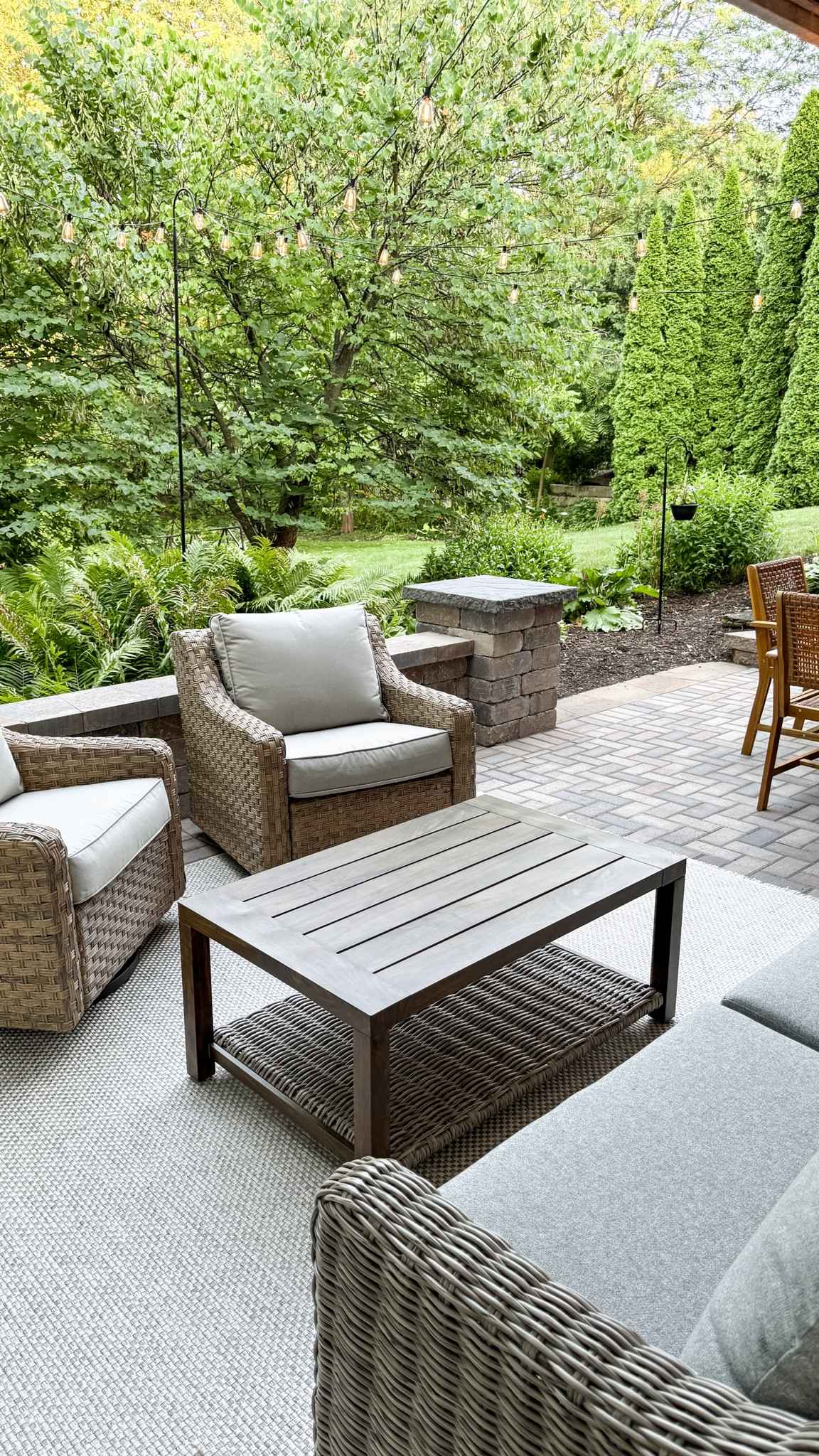 Outdoor living.  Rug. Patio furniture. String Lights. Bistro lights  

#LTKHome #LTKSeasonal